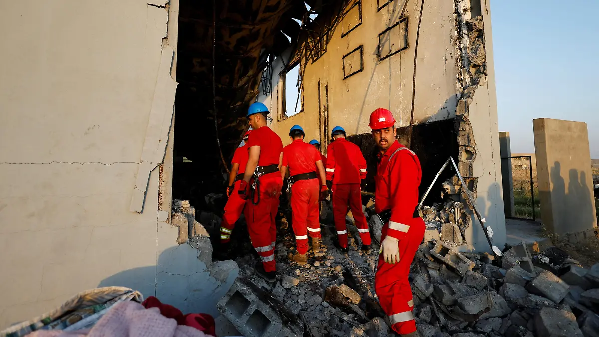 Officials work at the site following a fatal fire at a wedding celebration, in the district of Hamdaniya in Iraq's Nineveh province, Iraq, September 27, 2023. REUTERS/Khalid Al-Mousily