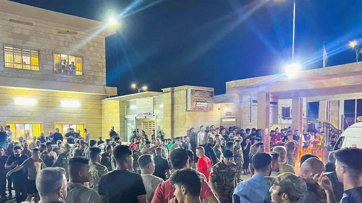 Security forces and emergency responders among others gather at a hospital following a fatal fire at a wedding celebration, in the district of Hamdaniya in Iraq's Nineveh province, Iraq, September 27, 2023. REUTERS/Abdullah Rashid