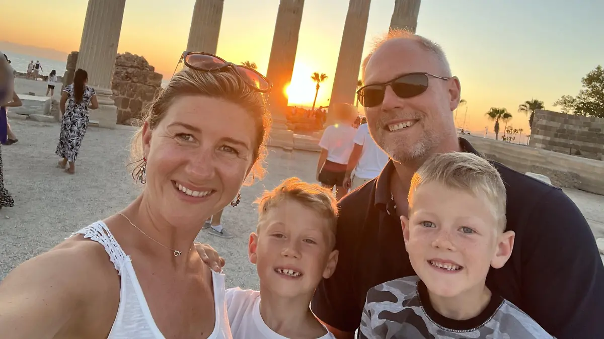 PIC FROM Kennedy News and Media (Pictured:MONIKA SHAKESHEFF, 35, WITH 50-YEAR-OLD HUSBAND MATTHEW SHAKESHEFF AND CHARLIE SHAKESHEFF, 7, AND OLLIE SHAKESHEFF, 9.) A mum claims her nine-year-old son's bit of 'holiday fun' henna tattoo has left him 'scarred for life' - after it hospitalised him with chemical burns. Monika Shakesheff from Bridgetown in Stratford-upon-Avon, let her two sons, Ollie Shakesheff, nine, and seven-year-old Charlie Shakesheff, get the temporary inkings done while on holiday in a Tui-managed hotel in Turkey last month. Ollie chose a 10cm wolf inking that he had drawn on the left side of his chest while Charlie plumped for a 10cm outline of footy legend Ronaldo traced onto his left leg. DISCLAIMER: While Kennedy News and Media uses its best endeavours to establish the copyright and authenticity of all pictures supplied, it accepts no liability for any damage, loss or legal action caused by the use of images supplied and the publication of images is solely at your discretion. SEE KENNEDY NEWS COPY - 0161 697 4266