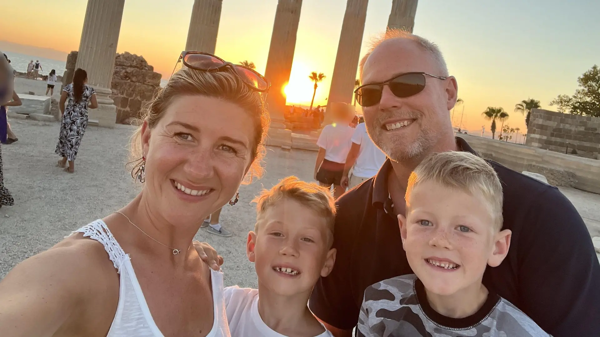 PIC FROM Kennedy News and Media (Pictured:MONIKA SHAKESHEFF, 35, WITH 50-YEAR-OLD HUSBAND MATTHEW SHAKESHEFF AND CHARLIE SHAKESHEFF, 7, AND OLLIE SHAKESHEFF, 9.) A mum claims her nine-year-old son's bit of 'holiday fun' henna tattoo has left him 'scarred for life' - after it hospitalised him with chemical burns. Monika Shakesheff from Bridgetown in Stratford-upon-Avon, let her two sons, Ollie Shakesheff, nine, and seven-year-old Charlie Shakesheff, get the temporary inkings done while on holiday in a Tui-managed hotel in Turkey last month. Ollie chose a 10cm wolf inking that he had drawn on the left side of his chest while Charlie plumped for a 10cm outline of footy legend Ronaldo traced onto his left leg. DISCLAIMER: While Kennedy News and Media uses its best endeavours to establish the copyright and authenticity of all pictures supplied, it accepts no liability for any damage, loss or legal action caused by the use of images supplied and the publication of images is solely at your discretion. SEE KENNEDY NEWS COPY - 0161 697 4266