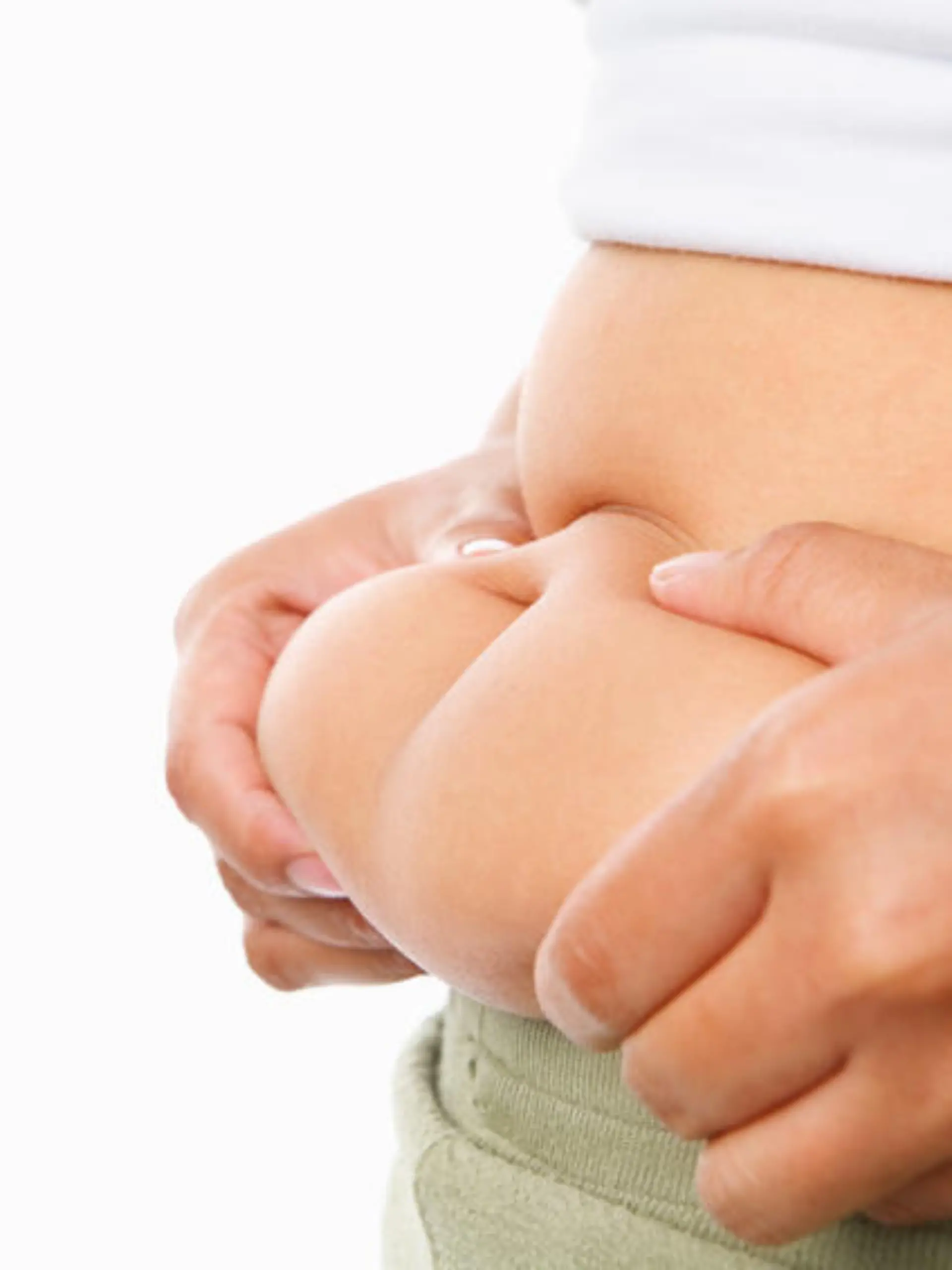 hand pinching fat on tummy for obese concept over white background