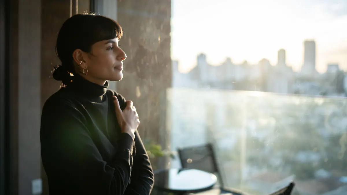 Young woman contemplating at home