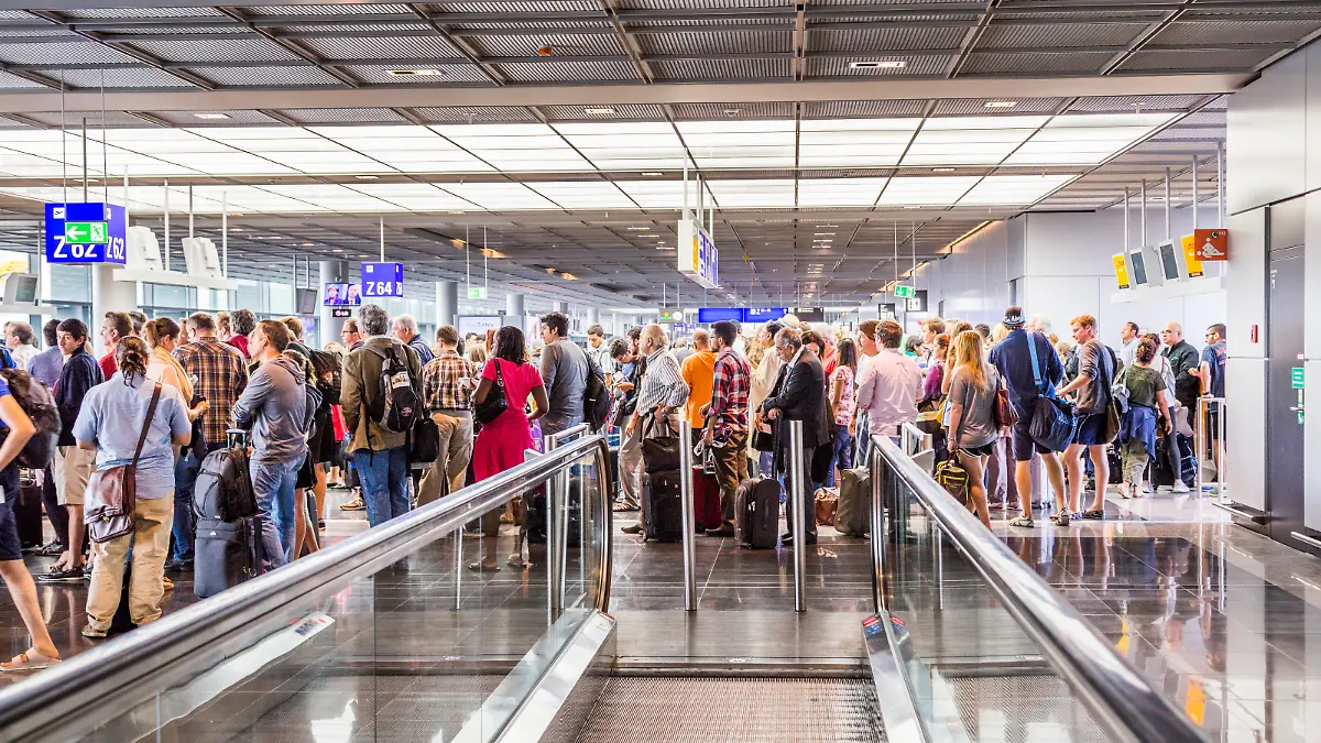 Frankfurt, Germany - August 16, 2014: passengers at the departure hall. With 38 million passengers per year it is one of the most important airport in Europe.