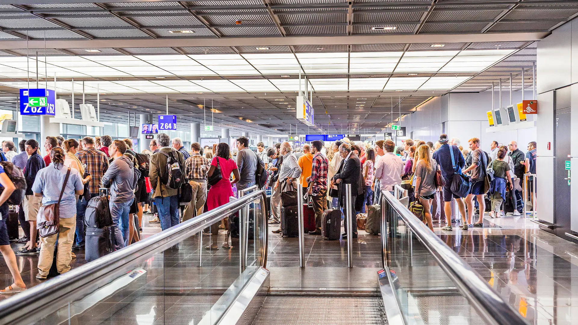 Frankfurt, Germany - August 16, 2014: passengers at the departure hall. With 38 million passengers per year it is one of the most important airport in Europe.