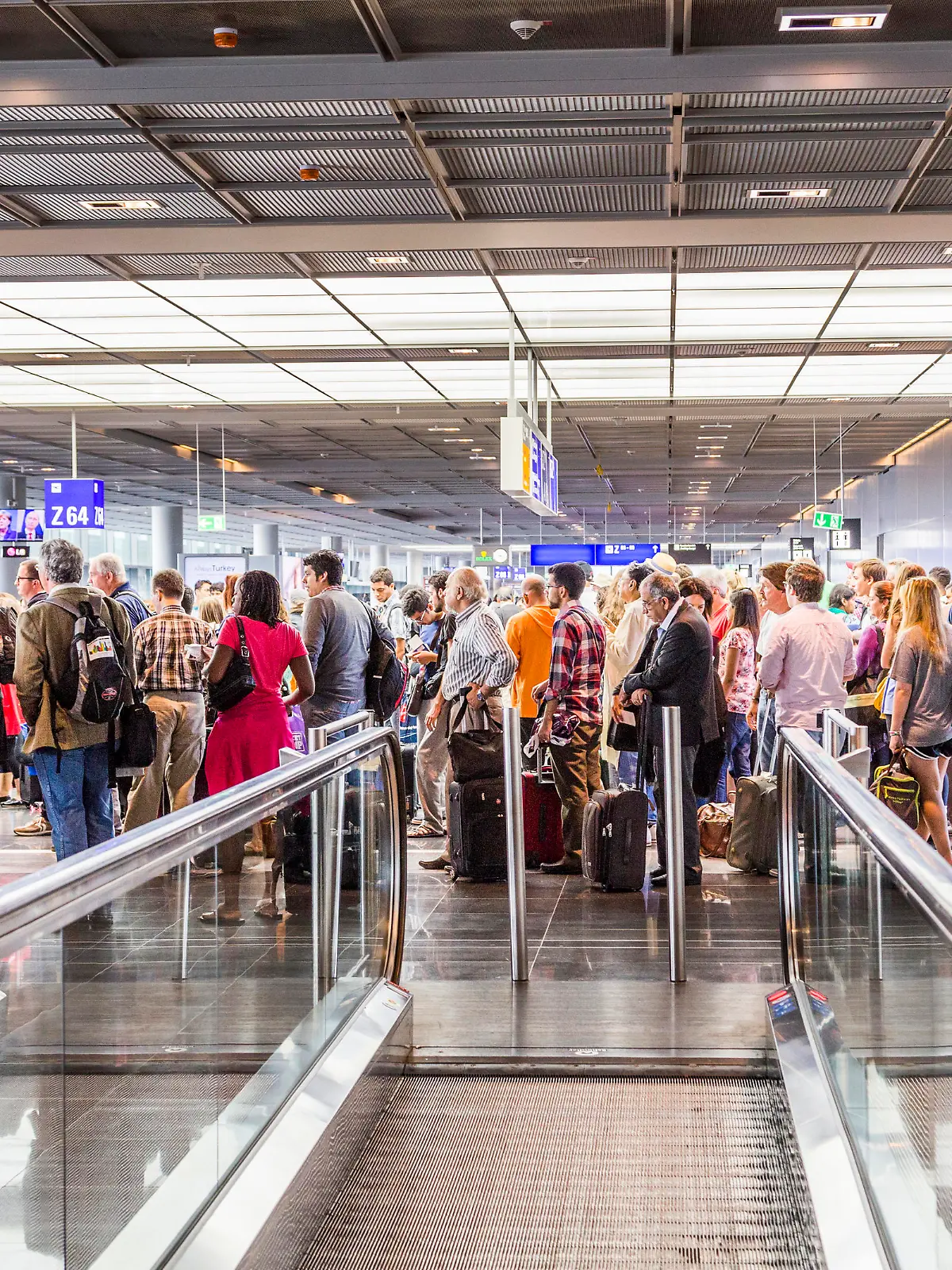 Frankfurt, Germany - August 16, 2014: passengers at the departure hall. With 38 million passengers per year it is one of the most important airport in Europe.