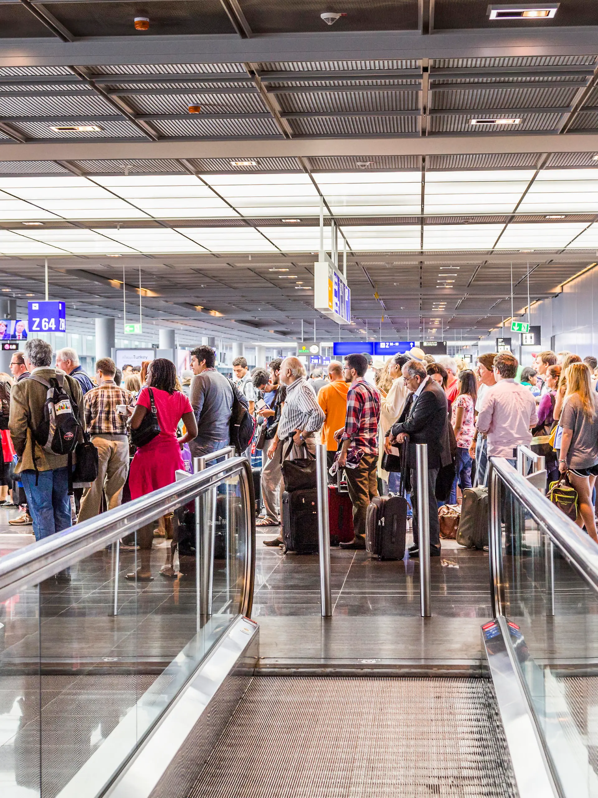 Frankfurt, Germany - August 16, 2014: passengers at the departure hall. With 38 million passengers per year it is one of the most important airport in Europe.