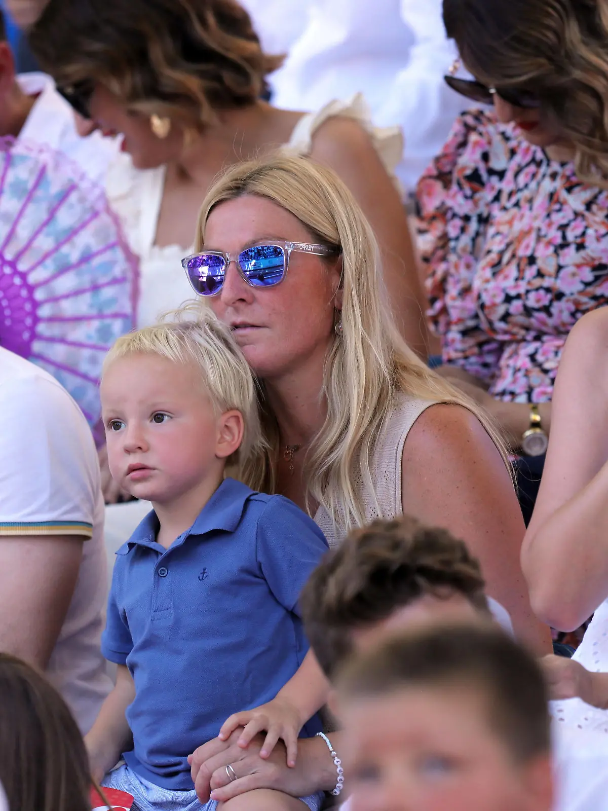 PXL_Traditional Alkar competiton was held in Sinj A former Croatian alpine skier Janica Kostelic with her son in the audience during the famous knight s game Sinjska Alka that was held for the 306th time in Sinj on August 8, 2021. Alka is the last stage of the competition after Bara and Coja. Alka is a competition in which alkars ride horses to throw an alka spear. The Alkar competition is conducted in such a way that the Alkar on horseback in a full race spears a spear that hangs in the middle of a rope stretched horizontally between two pillars attached to the edges of the racetrack. Each alkar wears an antique knight s uniform in the most beautiful splendor, consisting of a underpants trousers, a silk belt, embroidered barley and a shi IvoxCagalj/PIXSELL 