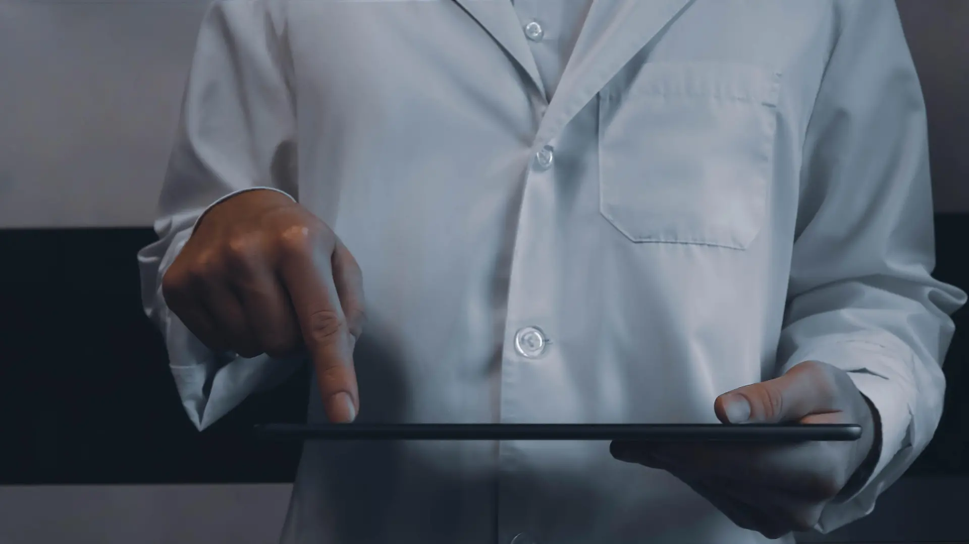 Digitalizing healthcare closeup concept image. Front view photo of male practitioner browsing records on tablet. Picture for web banner, landing page, blog, news and article. Website header design