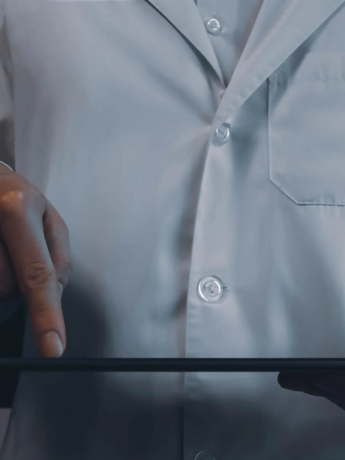 Digitalizing healthcare closeup concept image. Front view photo of male practitioner browsing records on tablet. Picture for web banner, landing page, blog, news and article. Website header design
