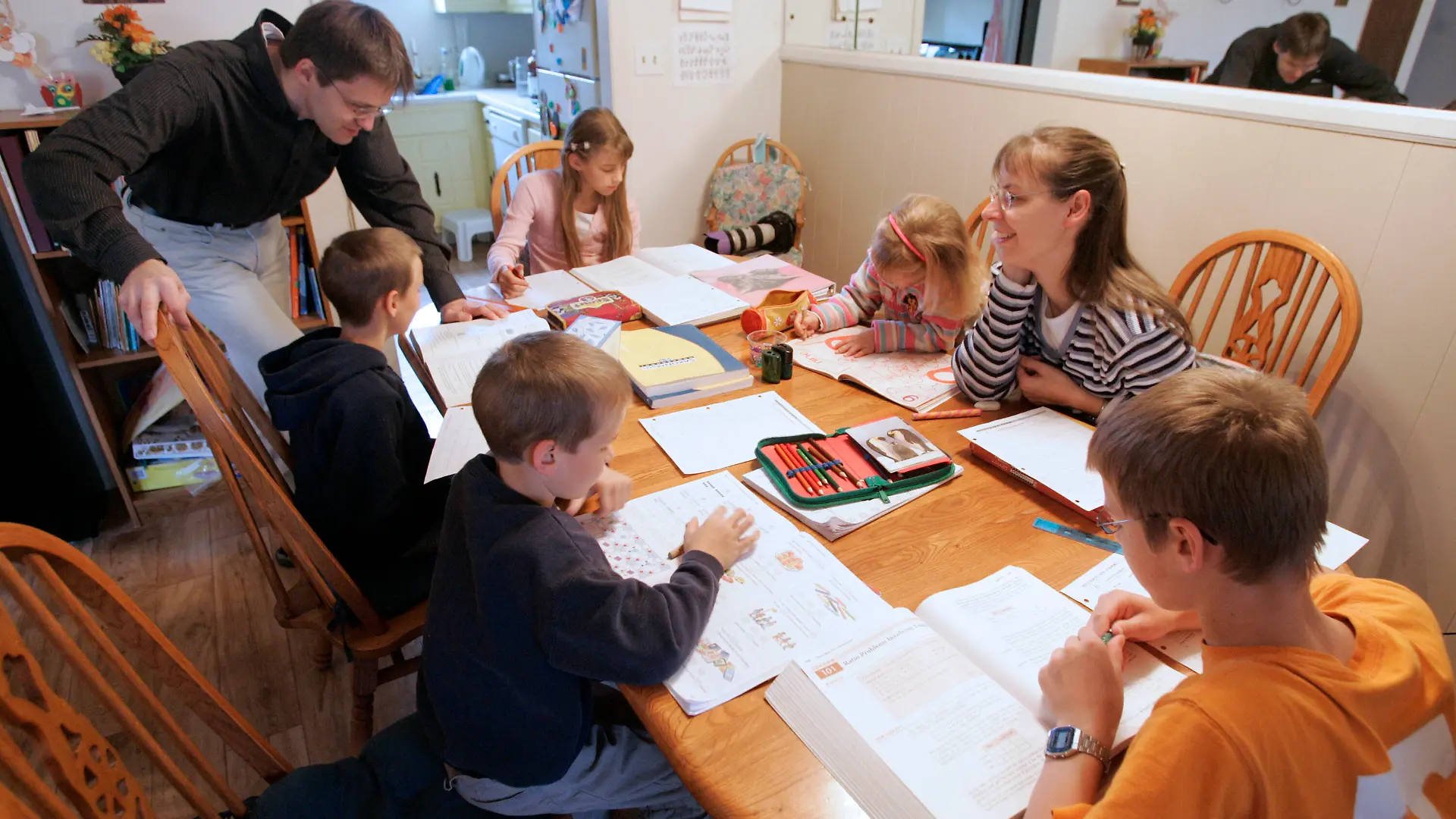 FILE -- In this March 13, 2009, file photo, Uwe Romeike, top left, and his wife Hannelore, second from right, teach their children at their home in Morristown, Tenn. The family fled Germany in order to home-school their children, and is asking the U.S. Supreme Court to grant them asylum. (AP Photo/Wade Payne, File)