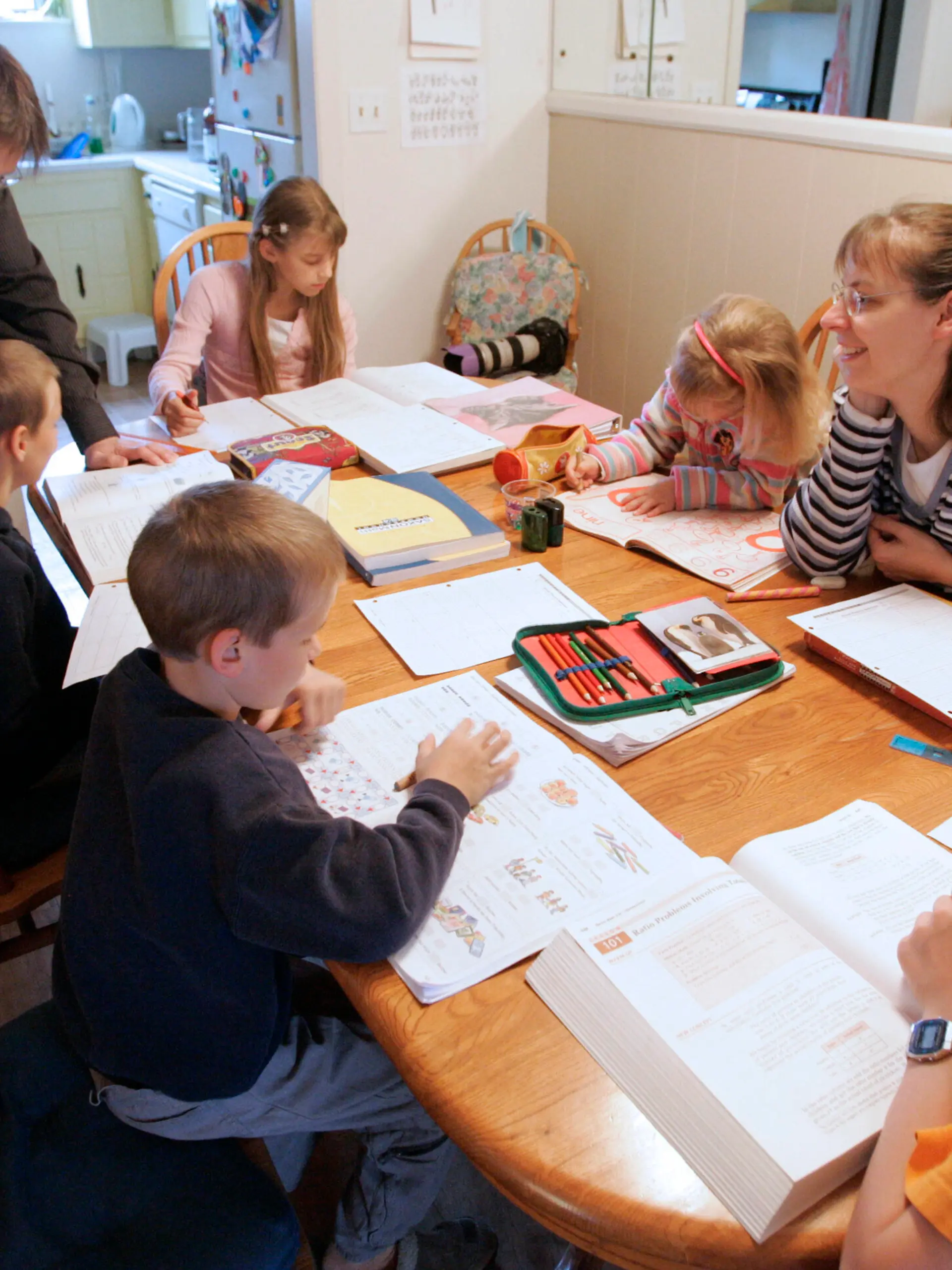 FILE -- In this March 13, 2009, file photo, Uwe Romeike, top left, and his wife Hannelore, second from right, teach their children at their home in Morristown, Tenn. The family fled Germany in order to home-school their children, and is asking the U.S. Supreme Court to grant them asylum. (AP Photo/Wade Payne, File)