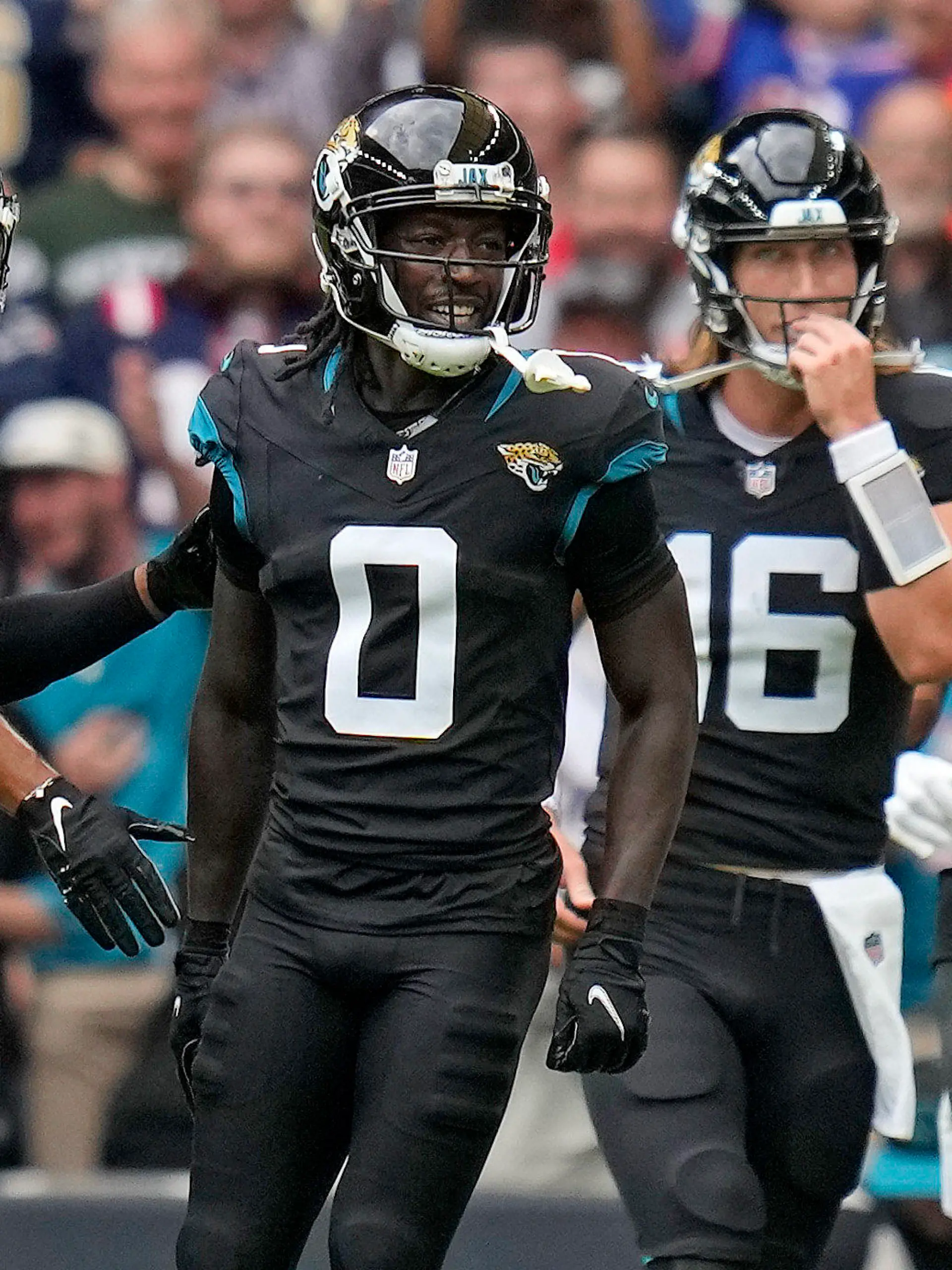 Jacksonville Jaguars wide receiver Calvin Ridley (0), second left, celebrates after scoring a touchdown during the first quarter of an NFL football game between the Atlanta Falcons and the Jacksonville Jaguars at Wembley stadium in London, Sunday, Oct. 1, 2023. (AP Photo/Kirsty Wigglesworth)