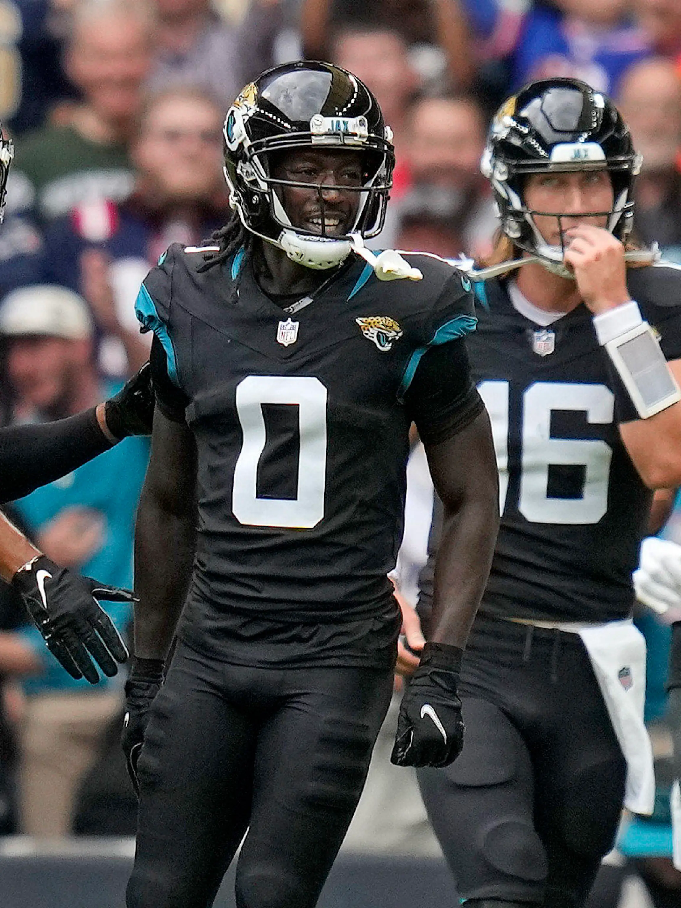 Jacksonville Jaguars wide receiver Calvin Ridley (0), second left, celebrates after scoring a touchdown during the first quarter of an NFL football game between the Atlanta Falcons and the Jacksonville Jaguars at Wembley stadium in London, Sunday, Oct. 1, 2023. (AP Photo/Kirsty Wigglesworth)