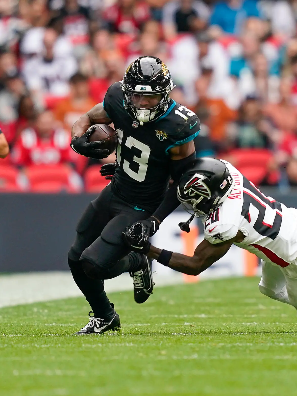 Jacksonville Jaguars v Atlanta Falcons International Series 01/10/2023. Atlanta Falcons CB Dee Alford 20 tackles Jacksonville Jaguars WR Christian Kirk 13 during the International Series match between Jacksonville Jaguars and Atlanta Falcons at Wembley Stadium, London, England on 1 October 2023. Editorial use only , Copyright: xJasonxBrownx PSI-18119-0060