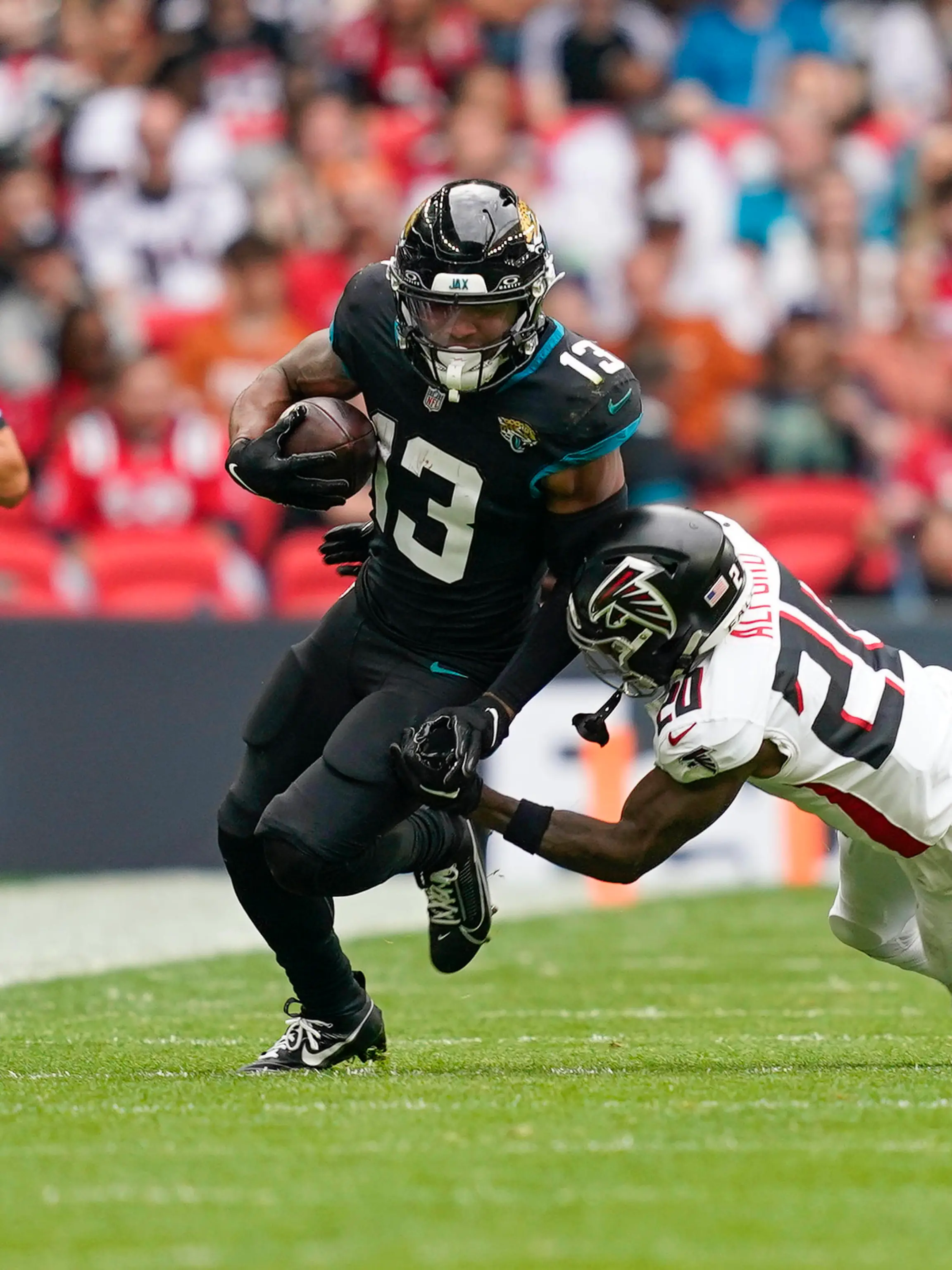 Jacksonville Jaguars v Atlanta Falcons International Series 01/10/2023. Atlanta Falcons CB Dee Alford 20 tackles Jacksonville Jaguars WR Christian Kirk 13 during the International Series match between Jacksonville Jaguars and Atlanta Falcons at Wembley Stadium, London, England on 1 October 2023. Editorial use only , Copyright: xJasonxBrownx PSI-18119-0060