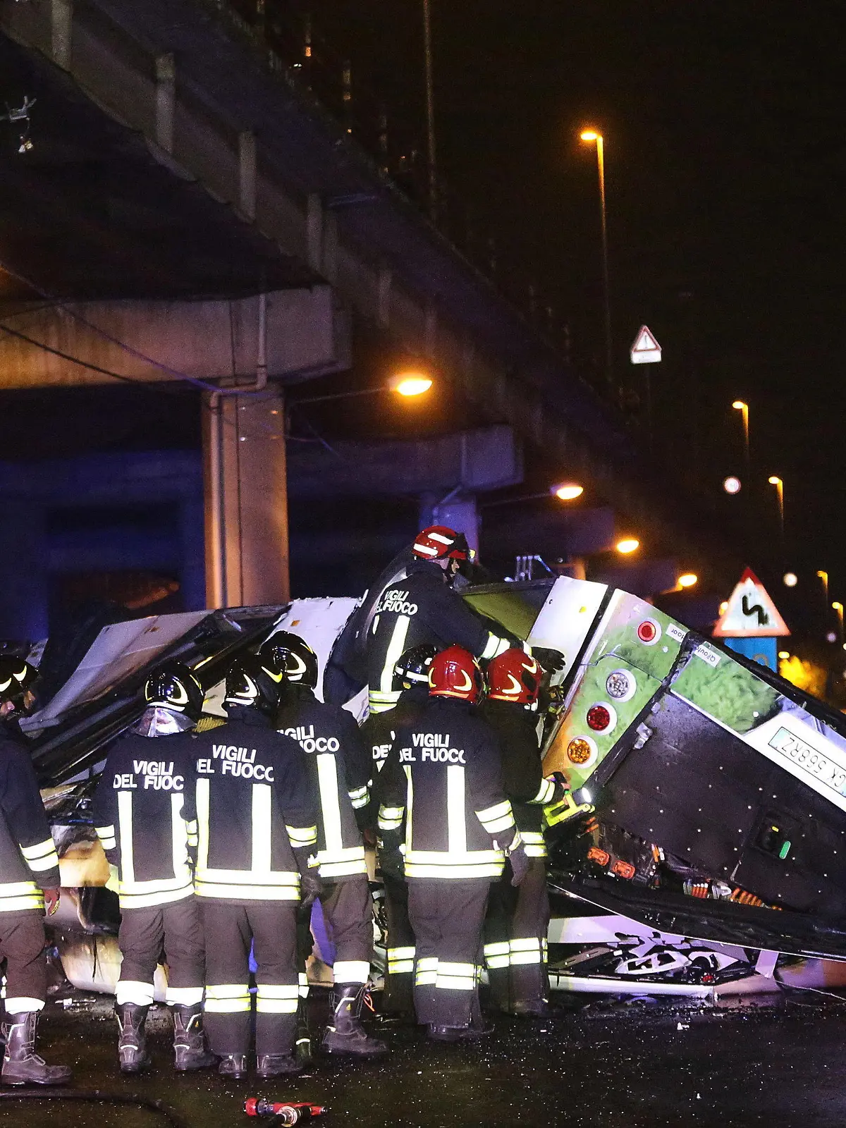 Firefighters work at the site where a passenger bus fell from an overpass ending up on railway tracks in Mestre, near Venice, Italy, late 03 October 2023. The bus was rented by tourists from the Hu campsite.At least 21 people died in the accident and 15 others were injured.3 Oct 2023//AGFEDITORIAL_RB041023-30/Credit:Mirco Toniolo/AGF/SIPA/2310041011