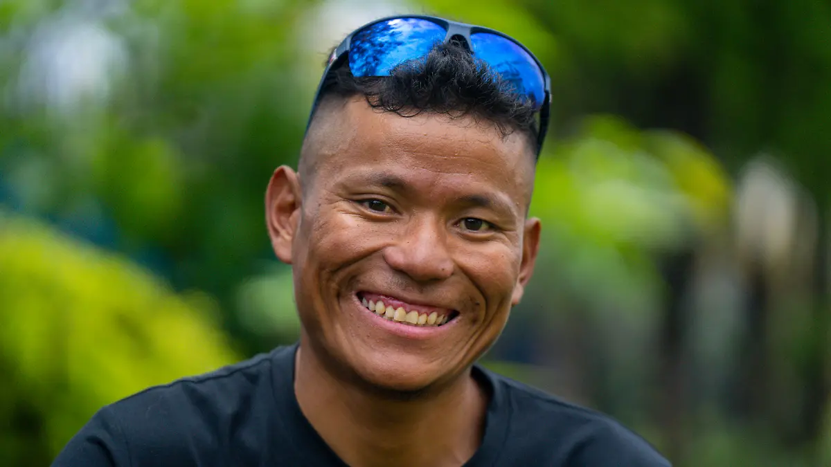 FILE- Nepal's sherpa guide Tenjen Sherpa, 35, smiles during an interview with the Associated Press in Kathmandu, Nepal, Aug. 9, 2023. Tenjen Sherpa and American climber Gina Marie Rzucidlo are reported missing after avalanches struck Tibet’s Mount Shishapangma on Saturday afternoon. American mountaineer Anna Gutu and Nepalese guide Mingmar Sherpa were confirmed Sunday dead according to Chinese media reports. (AP Photo/Niranjan Shrestha, File)
