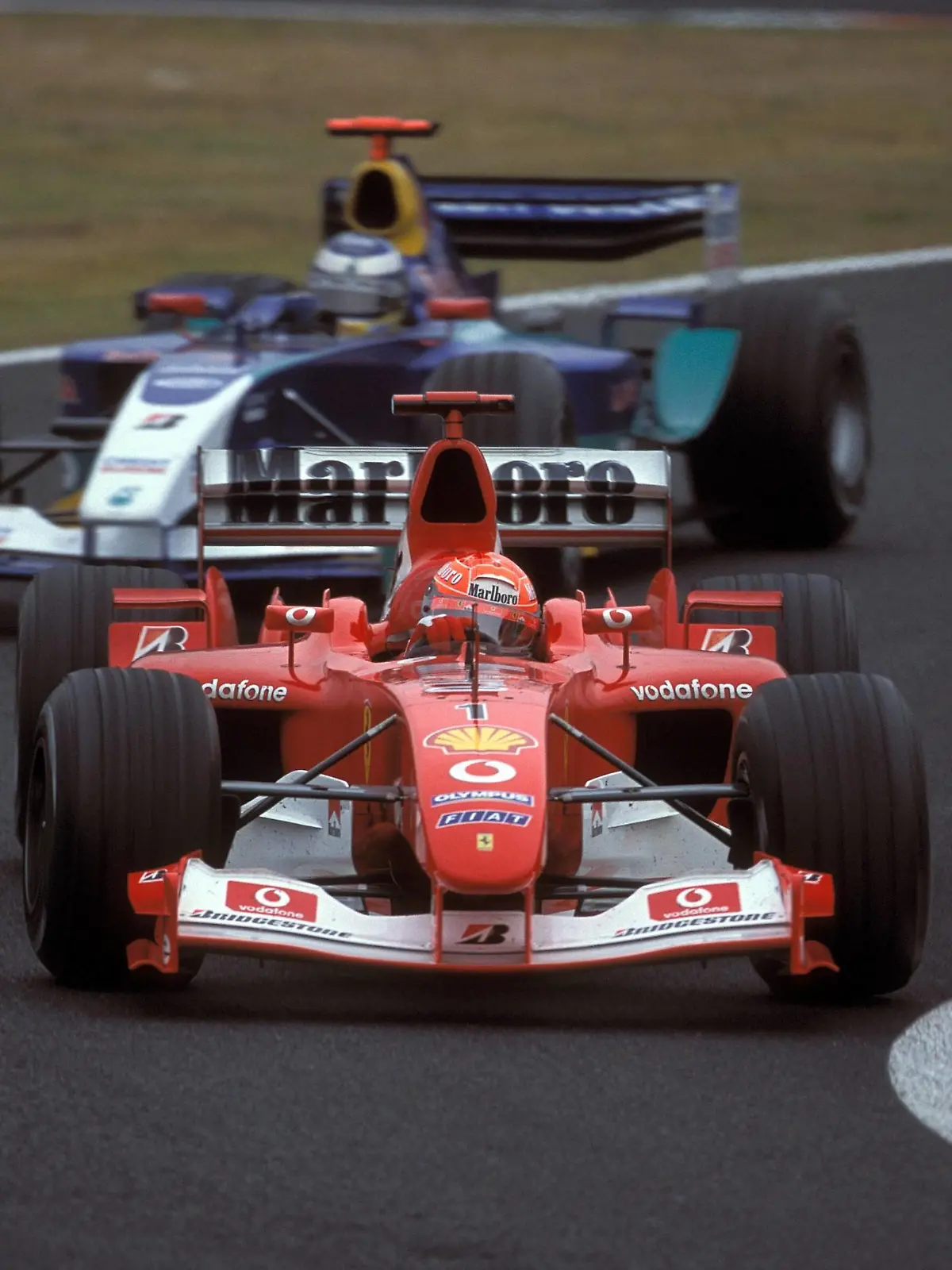 Bildnummer: 00949558  Datum: 12.10.2003  Copyright: imago/Andreas Beil
Michael Schumacher (vorn, Deutschland / Ferrari) in seinem Boliden; Rennwagen, Bolide, Boliden, quer Großer Preis von Japan 2003, Formel 1 Weltmeisterschaft, F1, F, GP, WM, Vdia Suzuka Motorsport Grand Prix Herren Einzel Japan Gruppenbild Aktion Personen Objekte