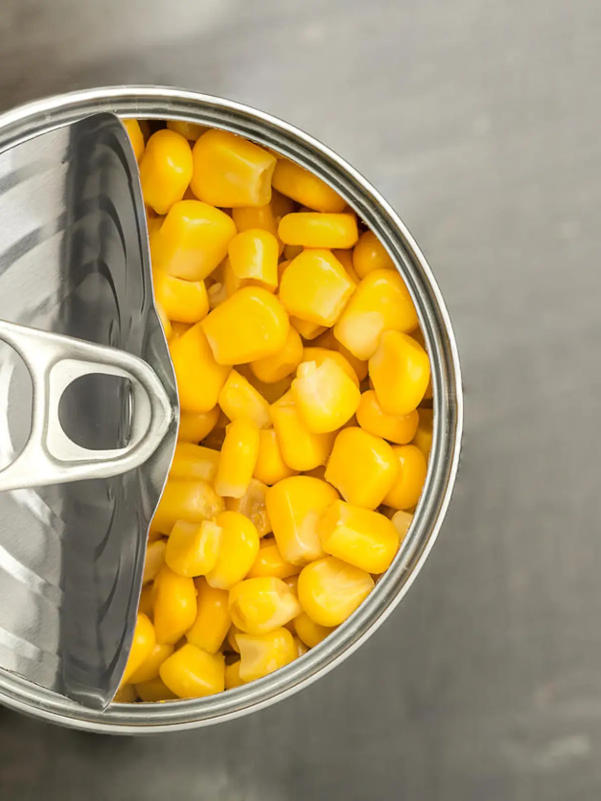 looking down on a tin of sweet corn