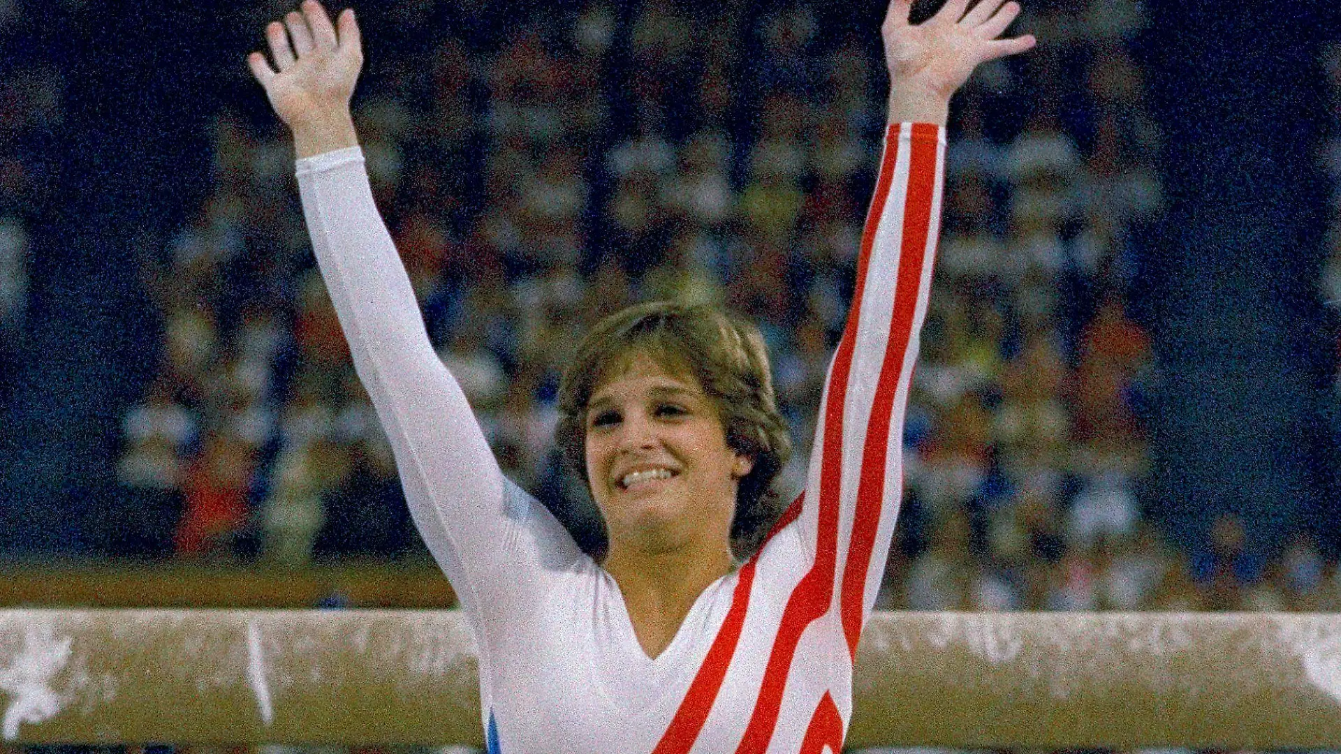 FILE- Mary Lou Retton reacts to applause after her performance at the Summer Olympics in Los Angeles on Aug. 3, 1984. Retton. 55, is in intensive care in a Texas hospital fighting a rare form of pneumonia, according to her daughter McKenna Kelley. (AP Photo/Suzanne Vlamis, File)