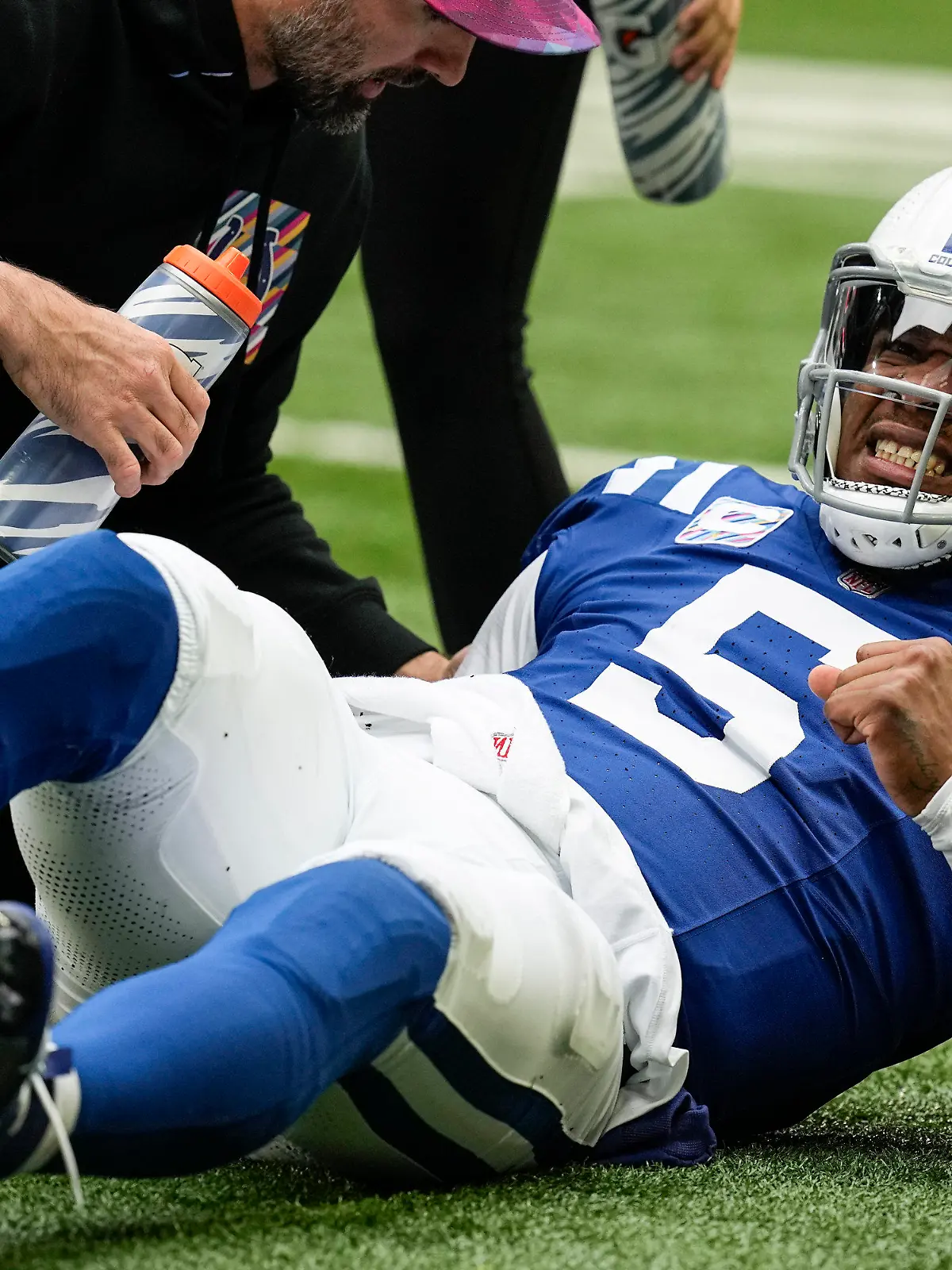 Indianapolis Colts quarterback Anthony Richardson (5) lies on the field after being injured during the first half of an NFL football game against the Tennessee Titans, Sunday, Oct. 8, 2023, in Indianapolis. (AP Photo/Darron Cummings)