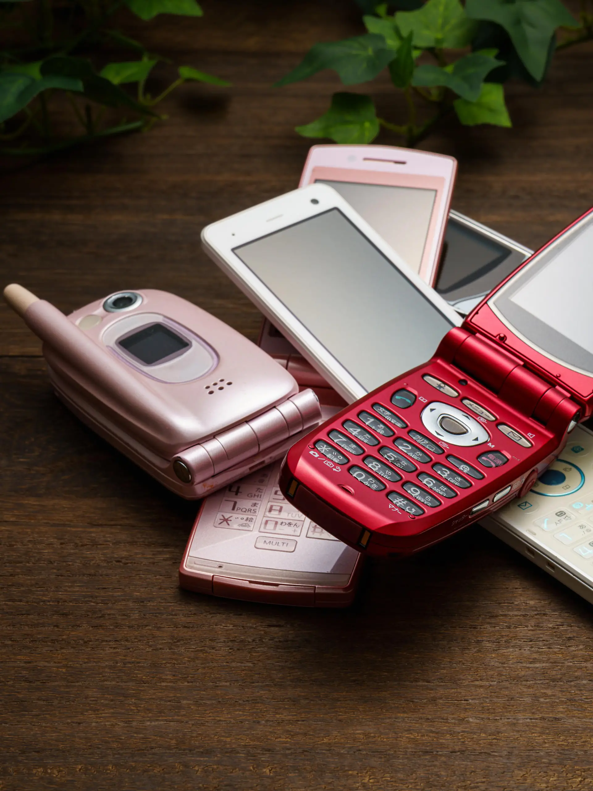 Old used cell phone on white background