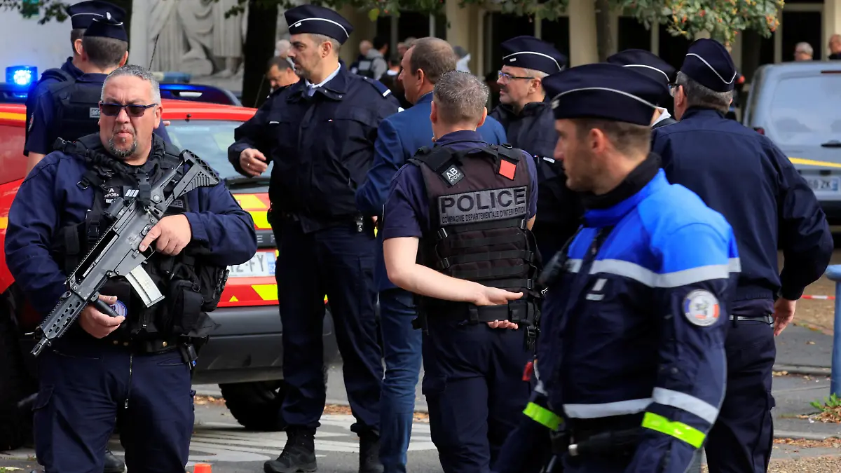 French police secure the area after a teacher was killed and several people injured in a knife attack at the Lycee Gambetta-Carnot high school in Arras, northern France, October 13, 2023. REUTERS/Pascal Rossignol