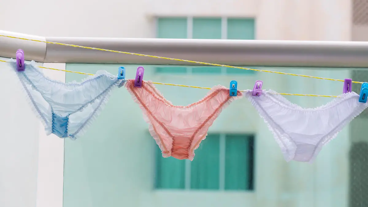 Female panties hanging on rope at balcony