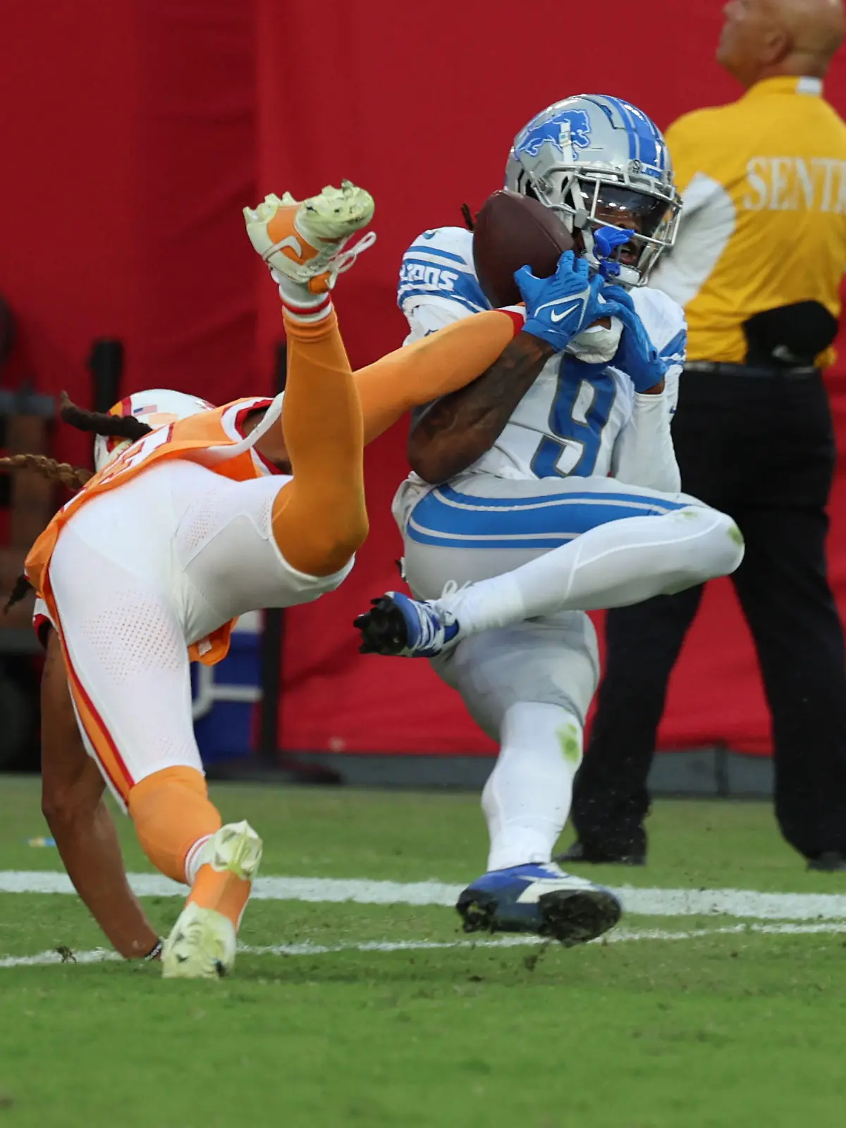 Oct 15, 2023; Tampa, Florida, USA; Detroit Lions wide receiver Jameson Williams (9) scores a touchdown while defended by Tampa Bay Buccaneers safety Ryan Neal (23) during the second half at Raymond James Stadium. Mandatory Credit: Kim Klement Neitzel-USA TODAY Sports