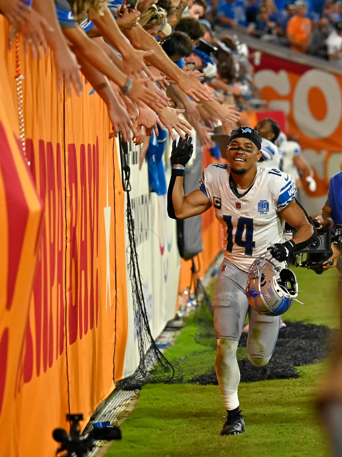 Detroit Lions wide receiver Amon-Ra St. Brown 14 celebrates with fans after Detroit beat the Tampa Bay Buccaneers 20-6 at Raymond James Stadium in Tampa, Florida on Sunday, October 15, 2023. PUBLICATIONxINxGERxSUIxAUTxHUNxONLY FLSN20231015121 STEVExNESIUS