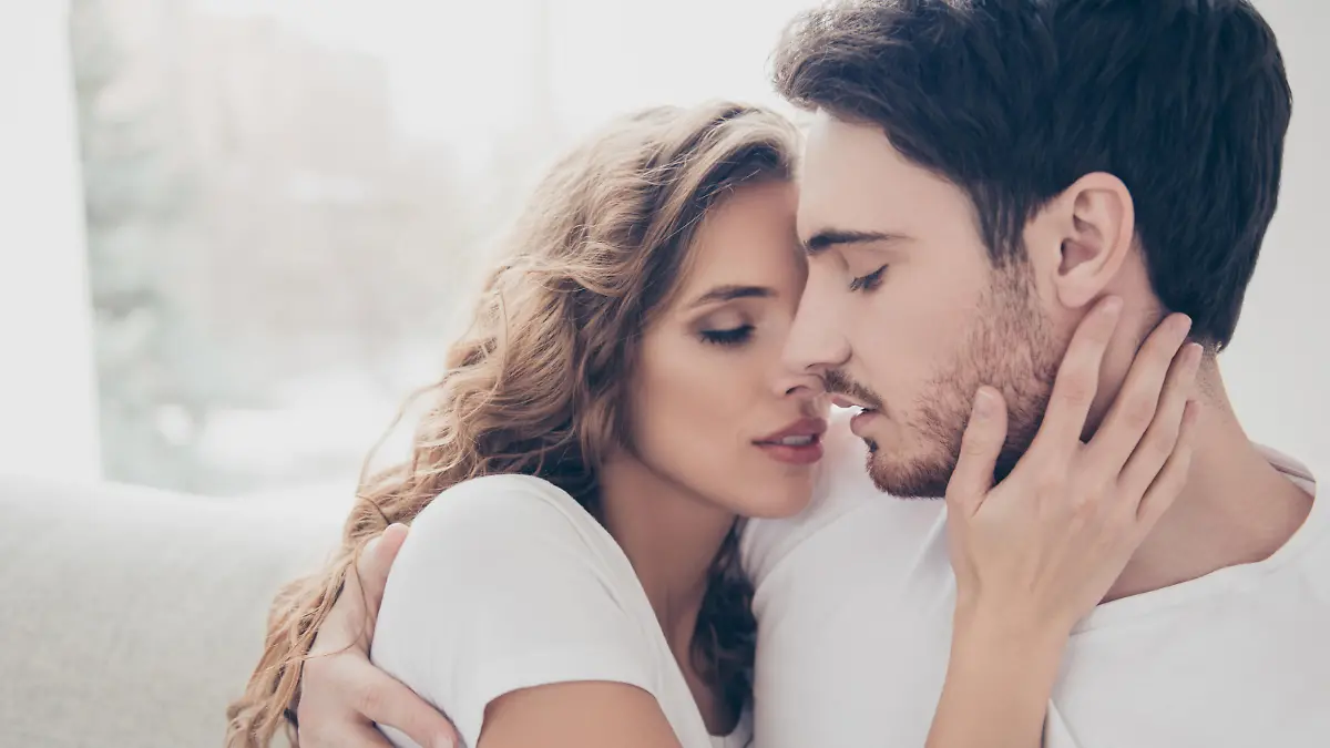 Recreation delight weekend holiday happiness satisfaction concept. Head shot portrait of romantic sexy couple keeping eyes closed enjoying time together kissing bonding indoor