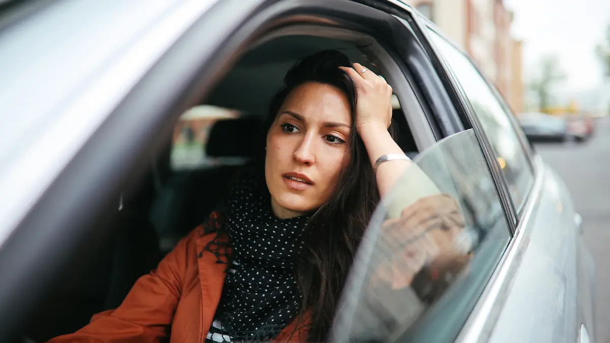 Young commuter woman driving in Berlin Mitte.