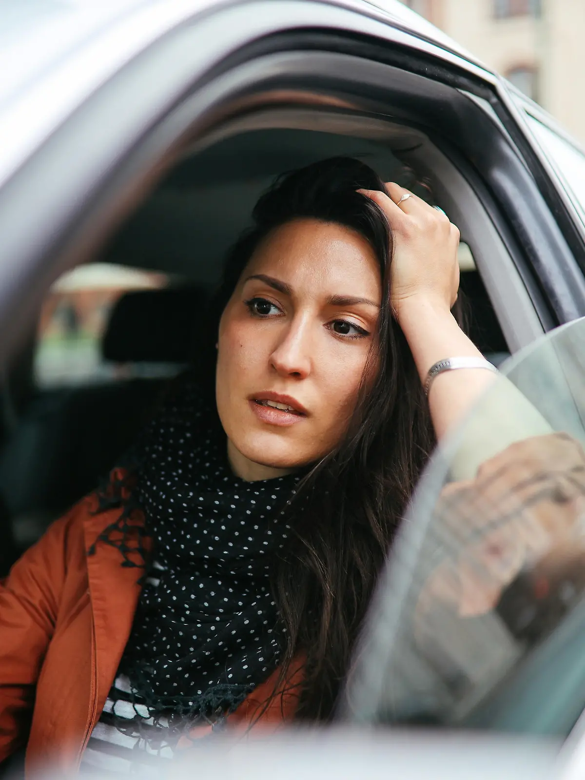 Young commuter woman driving in Berlin Mitte.