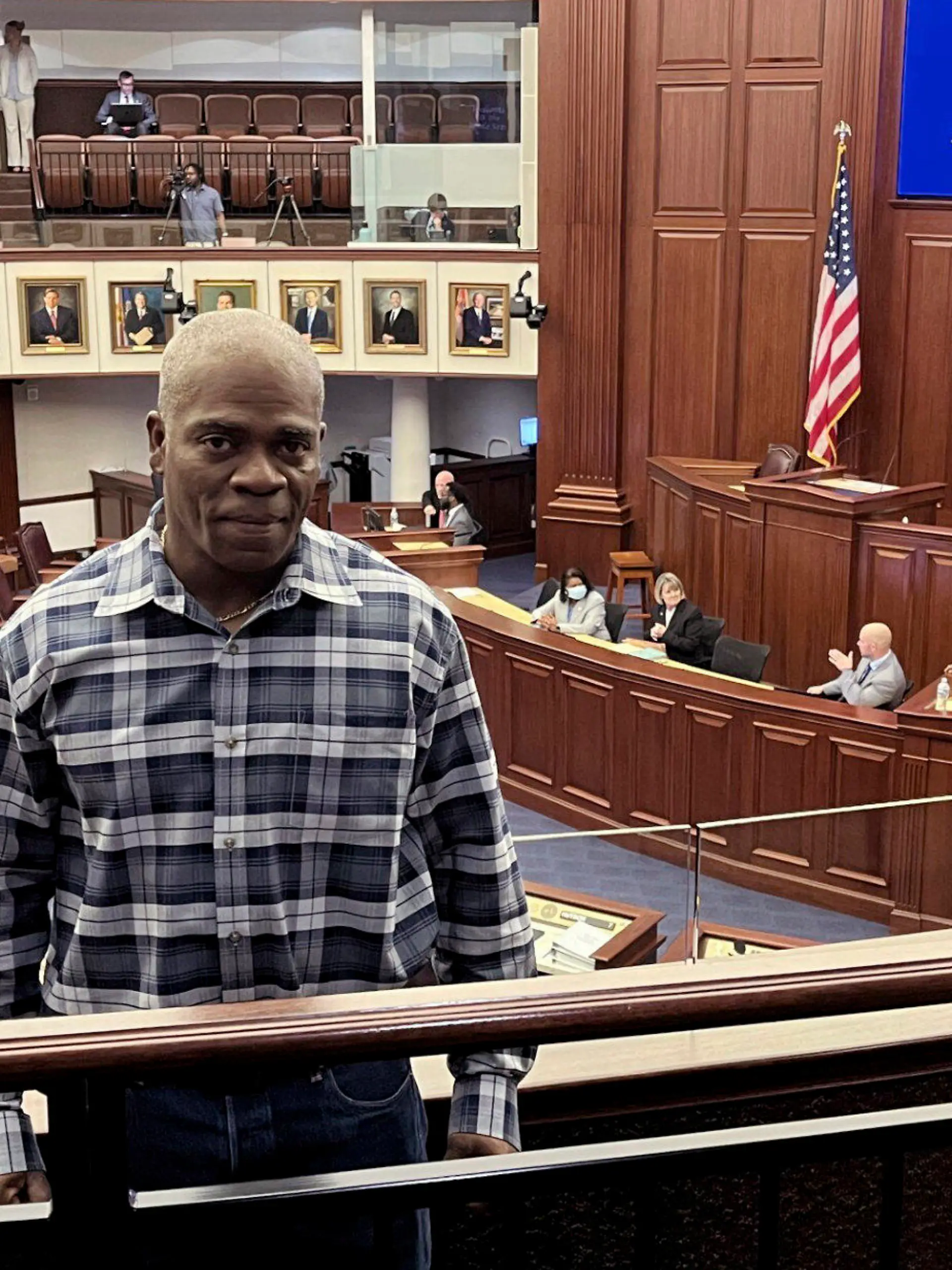 In this photo provided by the Innocence Project of Florida, Leonard Allen Cure poses from the floor of the Florida legislature in Tallahassee, Fla., in April 2023, on the day his compensation bill was passed. Cure, who spent more than 16 years in prison in Florida on a wrongful conviction, was shot and killed Monday, Oct. 156, by a sheriff's deputy in Georgia during a traffic stop, authorities and representatives said. (Innocence Project of Florida via AP)