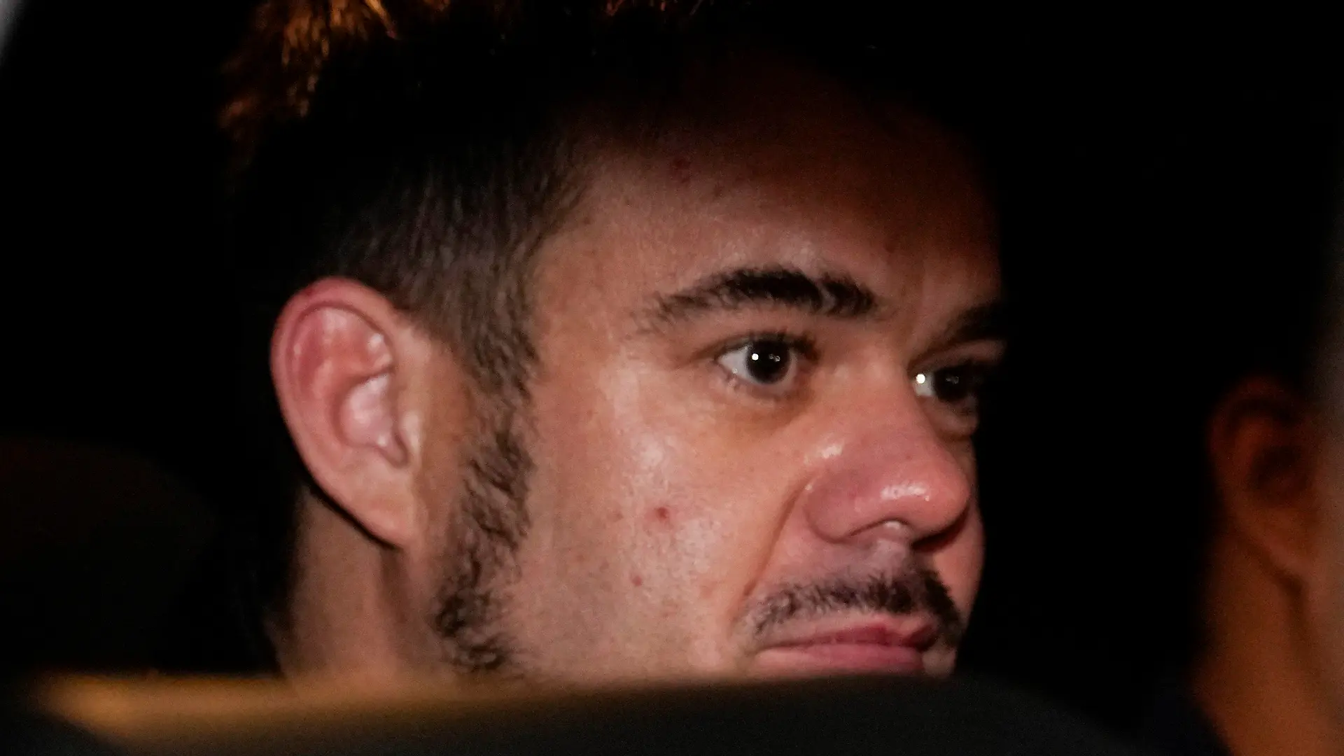FILE - Dutch citizen Joran van der Sloot is driven in a police vehicle from a maximum-security prison to an airport to be extradited to the U.S., on the outskirts of Lima, Peru, Thursday, June 8, 2023. Van der Sloot, the chief suspect in Natalee Holloway’s 2005 disappearance, is scheduled to appear in court Wednesday morning, Oct. 18, where he is expected to plead guilty to trying to extort money from her mother and provide new information about what happened to the missing teen. (AP Photo/Martin Mejia, File)