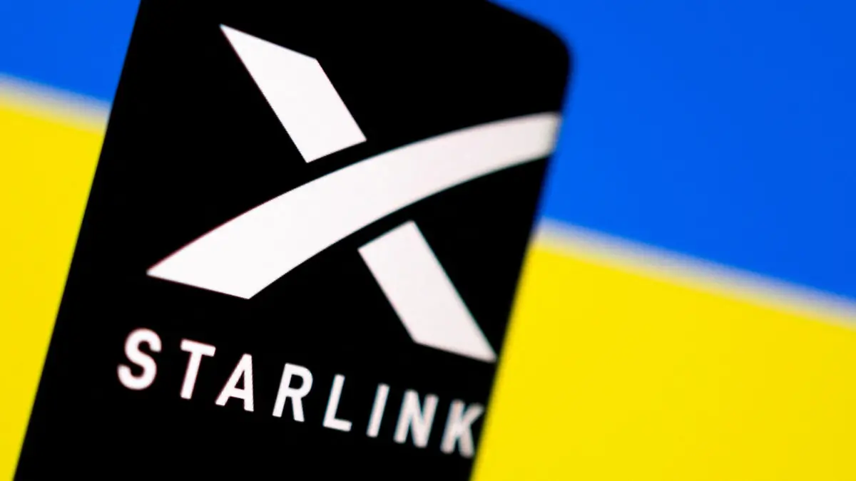 FILE PHOTO: Starlink logo is seen on a smartphone in front of displayed Ukrainian flag in this illustration taken February 27, 2022. REUTERS/Dado Ruvic/Illustration/File Photo