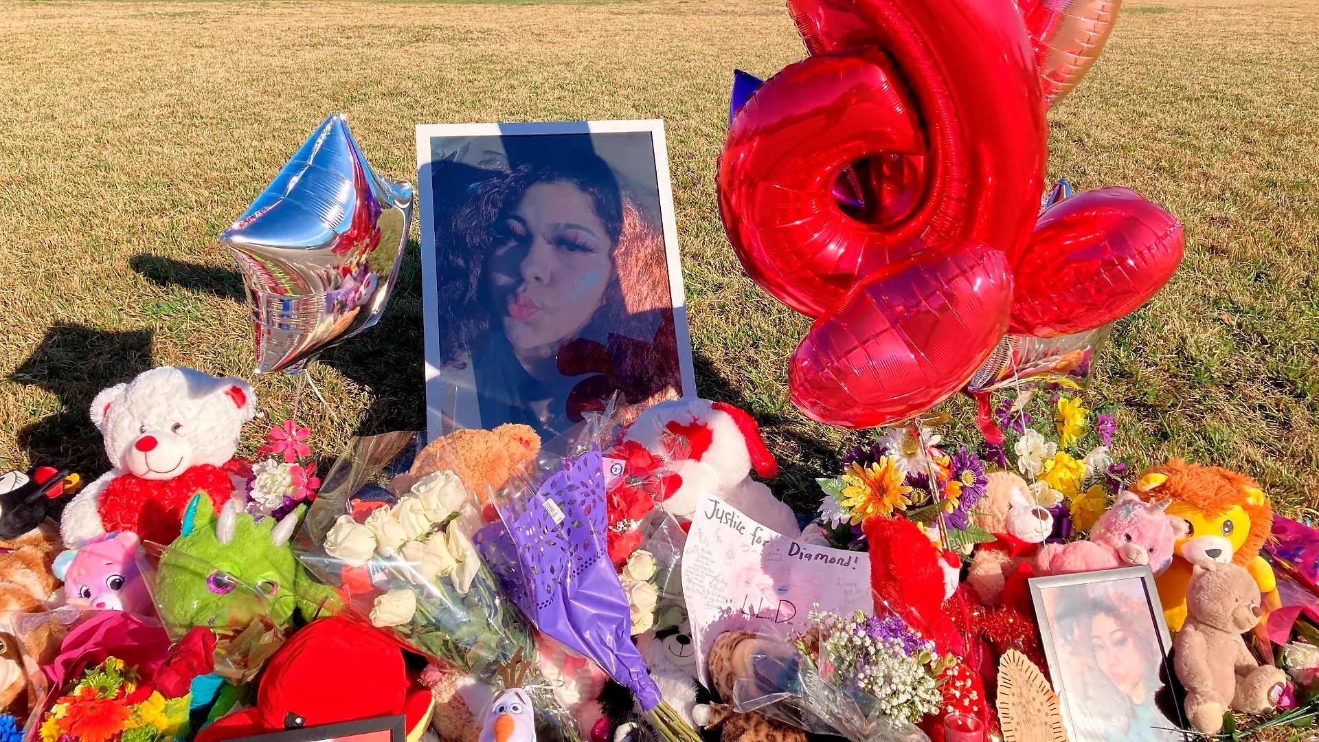 FILE - A makeshift memorial sits near the side of a street, Jan 13, 2022, in Houston, next to a large grassy area where Diamond Alvarez was fatally shot. Family members of the murdered 16-year-old girl attacked her ex-boyfriend during a court hearing Tuesday, Oct. 17, 2023, after he had pleaded guilty to shooting her nearly two dozen times while she was walking her dog. (AP Photo/Juan Lozano, File)
