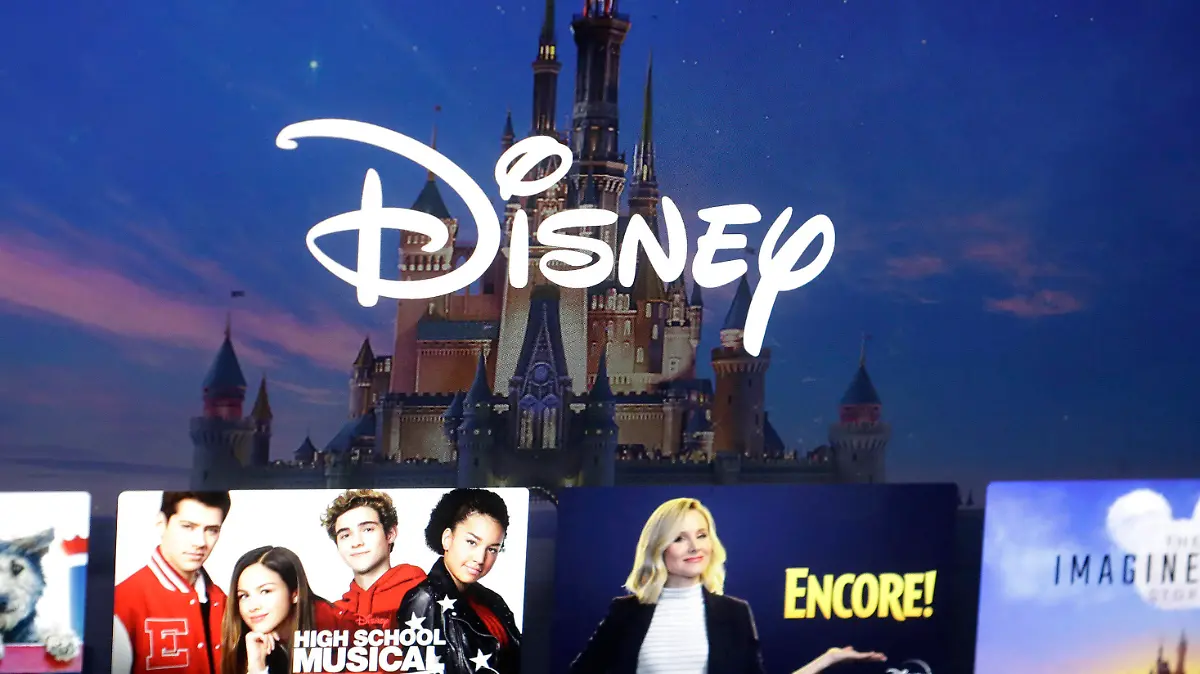 FILE - In this Nov. 13, 2019, photo, a Disney logo forms part of a menu for the Disney Plus movie and entertainment streaming service on a computer screen in Walpole, Mass. Password-sharing crackdowns are becoming more and more common in the streaming world today. And Disney Plus is following suit. In an email sent to the users in Canada, Disney announced upcoming restrictions on Canadian subscribers’ ability to share login credentials outside of their household — set to go into effect for most Canadian users on Nov. 1, 2023.   (AP Photo/Steven Senne, File)