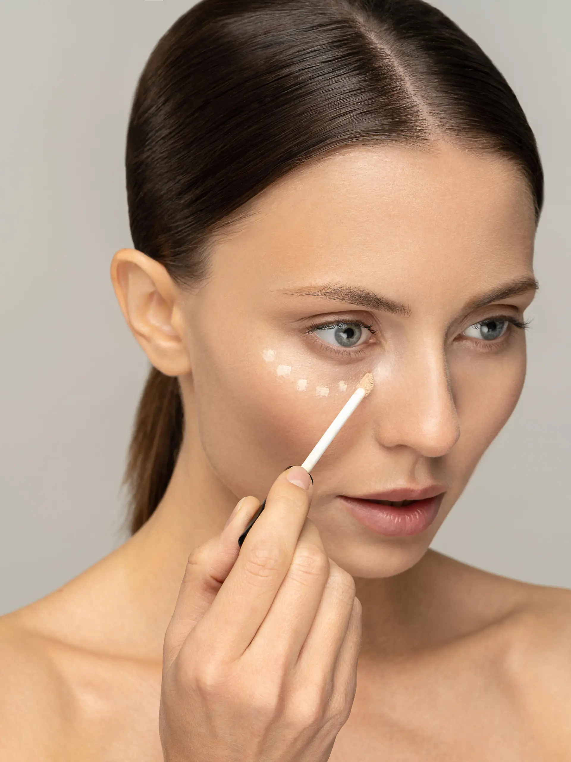 Woman  with  natural  makeup  applying  concealer  on  flawless  fresh  skin,  doing  make  up,  looking  at  mirror.  Girl  after  shower  put  corrector  under  eye  area.  Beauty  face,  skin  care.  Copy  space,  advertising. Model Released Property Released xkwx conceal,  face,  eye,  apply,  makeup,  corrector,  tassel,  applicator,  beauty,  foundation,  facial,  dots,  skincare,  eye  circles,  natural,  cosmetology,  cosmetic,  tone,  skin,  clean,  product,  vogue,  smooth,  wellness,  wellbeing,  isolated,  preparation,  perfection,  contour,  age,  routine,  primer,  beige,  coverage,  circles,  mirror,  girl,  woman,  under,  liquid,  model,  concealer,  cream,  pencil,  base,  visage,  brush,  caucasian