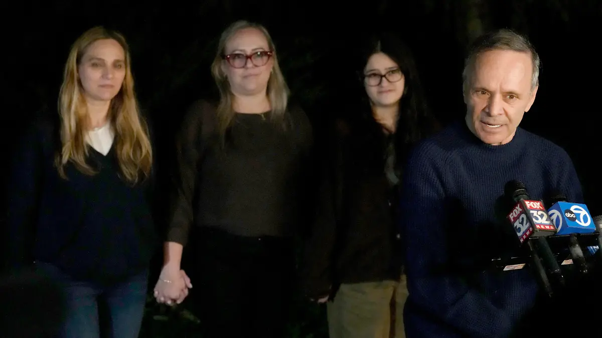 Uri Raanan, right, talks to reporters outside his Bannockburn, Ill., home with his sister Sigal Zamir, left, wife Paola Raanan, center, and her daughter Frida Alonso, after his daughter Natalie and her mother Judith Raanan were released by Hamas, Friday, Oct. 20, 2023. (AP Photo/Charles Rex Arbogast)