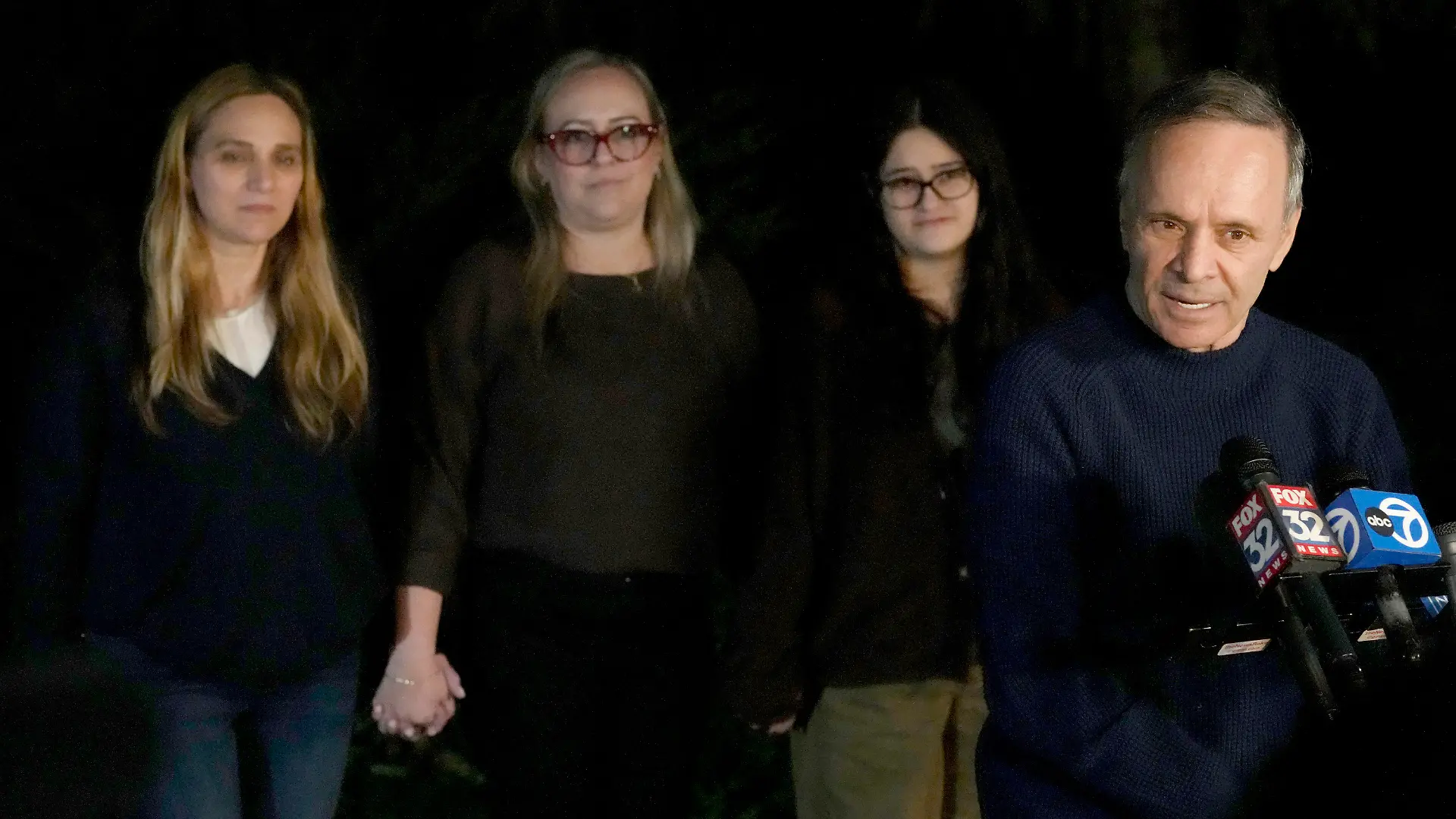 Uri Raanan, right, talks to reporters outside his Bannockburn, Ill., home with his sister Sigal Zamir, left, wife Paola Raanan, center, and her daughter Frida Alonso, after his daughter Natalie and her mother Judith Raanan were released by Hamas, Friday, Oct. 20, 2023. (AP Photo/Charles Rex Arbogast)