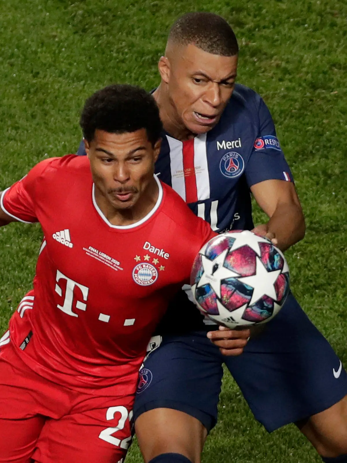 Bayern's Serge Gnabry, left, and PSG's Kylian Mbappe challenge for the ball during the Champions League final soccer match between Paris Saint-Germain and Bayern Munich at the Luz stadium in Lisbon, Portugal, Sunday, Aug. 23, 2020. (AP Photo/Manu Fernandez, Pool)