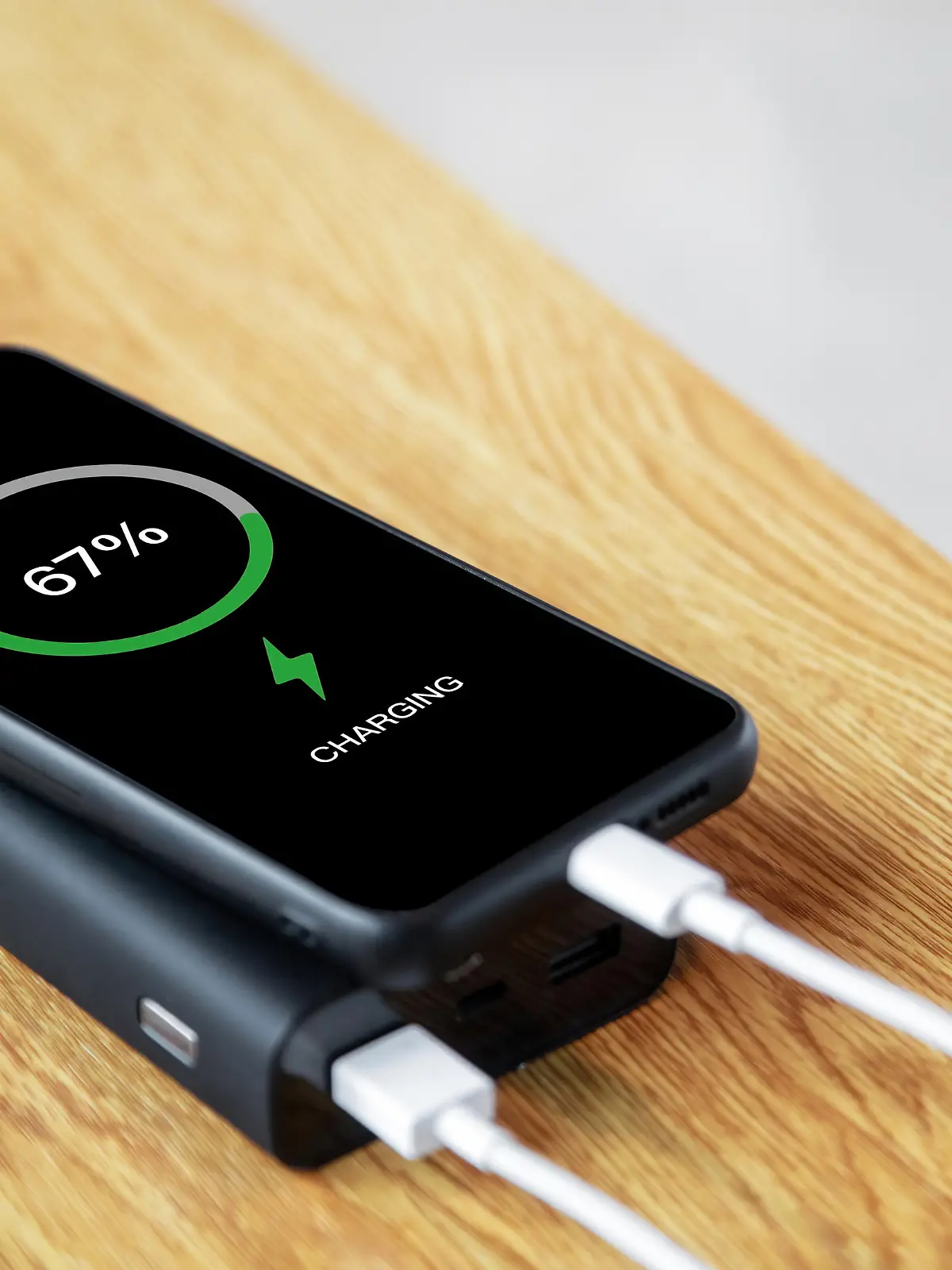 Use power bank to charge mobile phone anytime anywhere, charge sharing concept