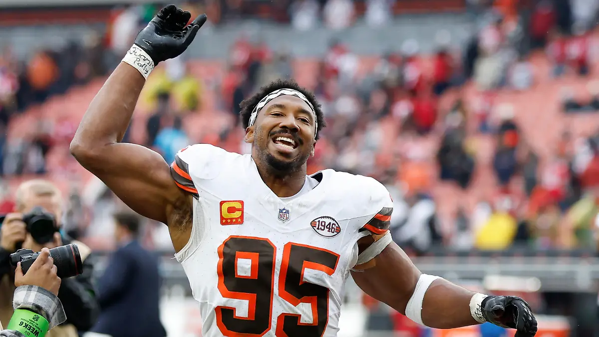 Cleveland Browns defensive end Myles Garrett (95) celebrates as he leaves the field after an NFL football game against the San Francisco 49ers Sunday, Oct. 15, 2023, in Cleveland. (AP Photo/Ron Schwane)