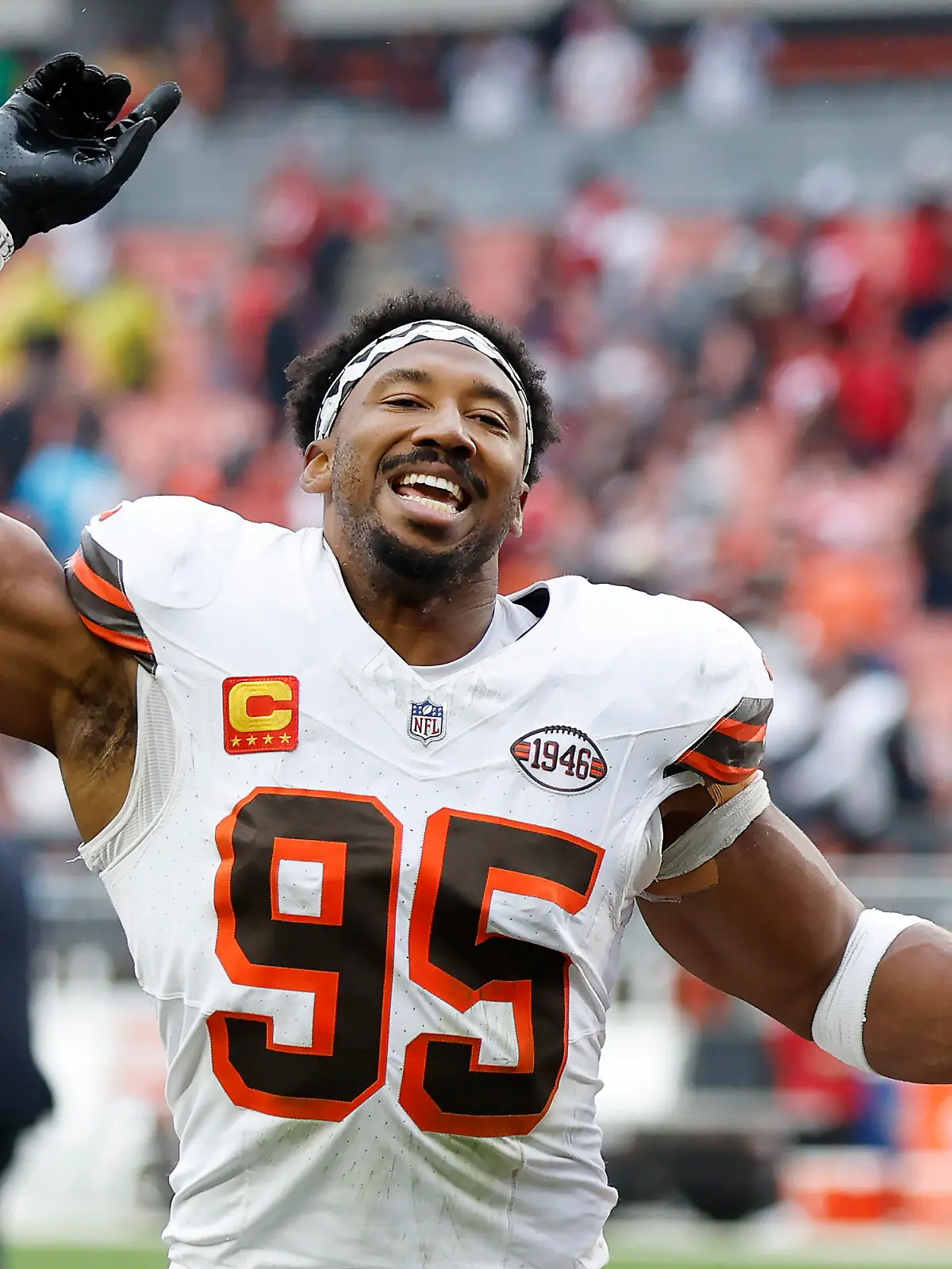 Cleveland Browns defensive end Myles Garrett (95) celebrates as he leaves the field after an NFL football game against the San Francisco 49ers Sunday, Oct. 15, 2023, in Cleveland. (AP Photo/Ron Schwane)