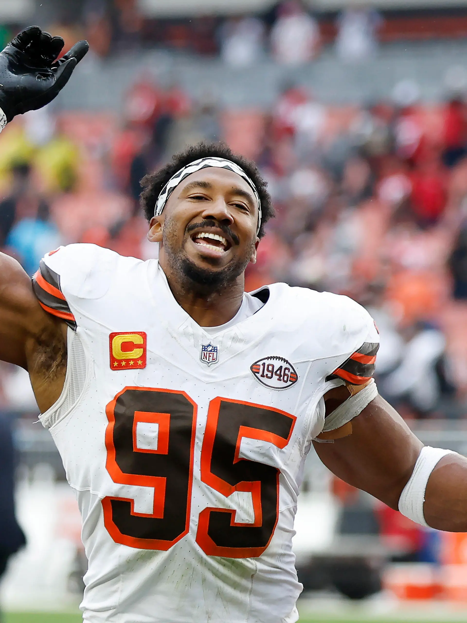Cleveland Browns defensive end Myles Garrett (95) celebrates as he leaves the field after an NFL football game against the San Francisco 49ers Sunday, Oct. 15, 2023, in Cleveland. (AP Photo/Ron Schwane)
