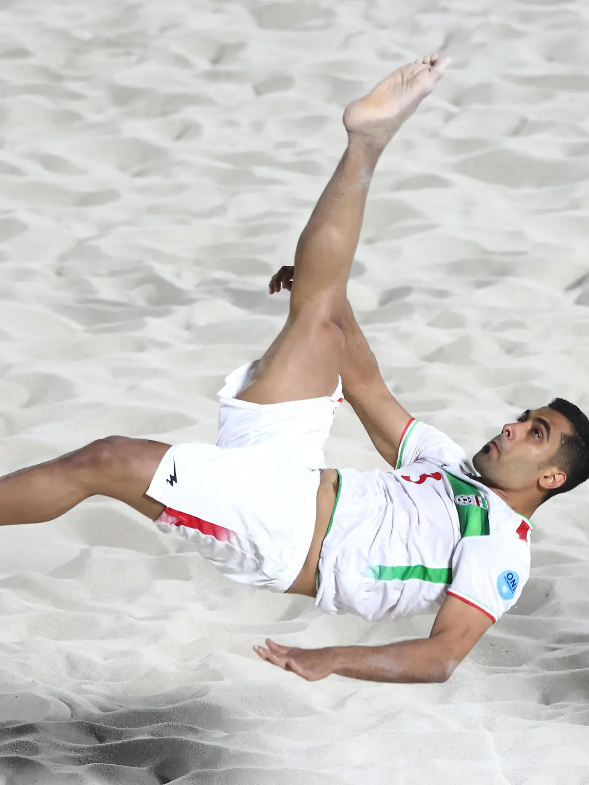 DUBAI, UNITED ARAB EMIRATES - NOVEMBER 01: Mohammad Masoumizadeh of Iran takes a shot at goal during the Emirates Intercontinental Beach Soccer Cup 2022 group match between Iran  and Paraguay  at Kite Beach on November 01, 2022 in Dubai, United Arab Emirates. (Photo by Francois Nel/Getty Images)