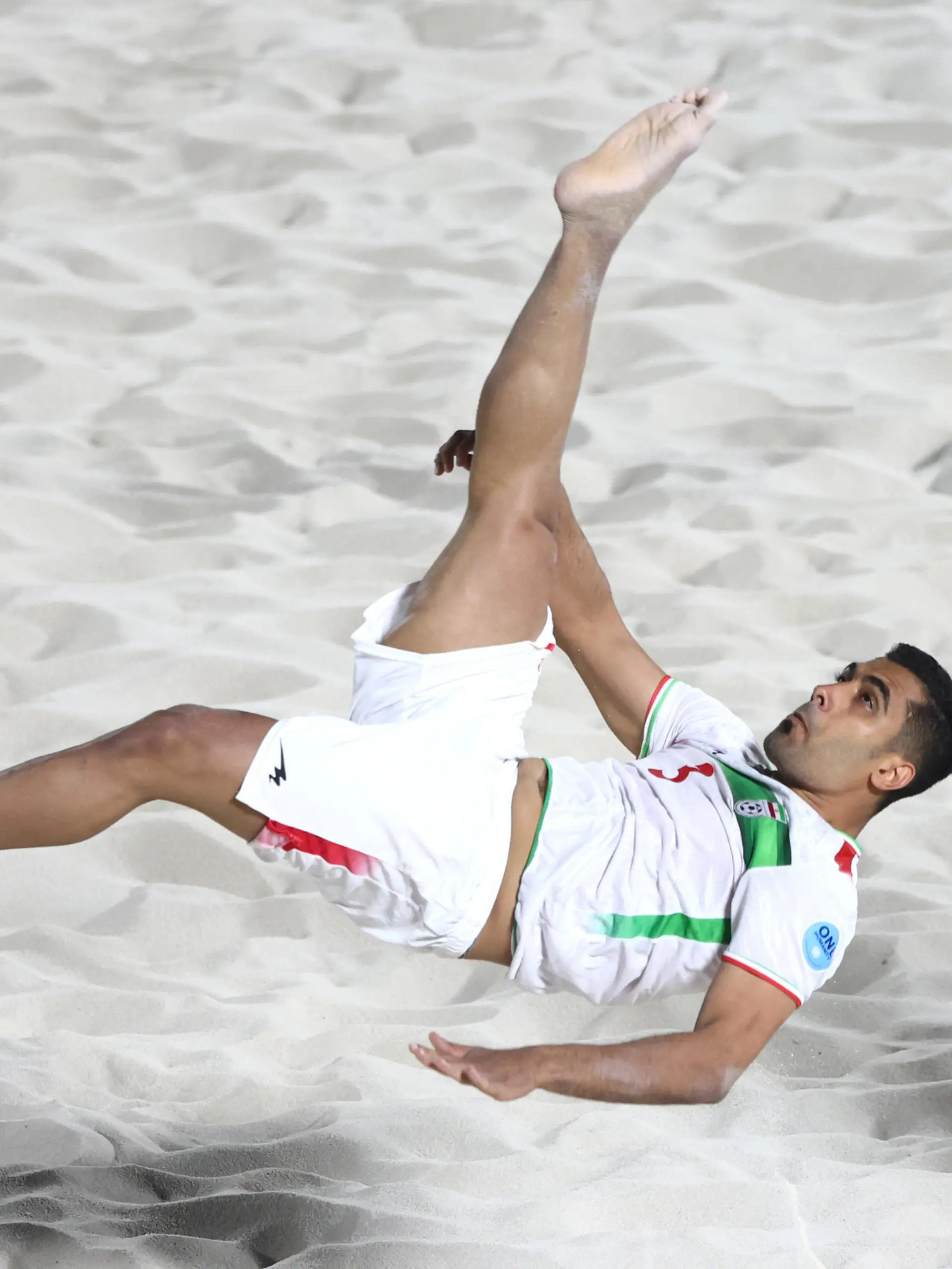 DUBAI, UNITED ARAB EMIRATES - NOVEMBER 01: Mohammad Masoumizadeh of Iran takes a shot at goal during the Emirates Intercontinental Beach Soccer Cup 2022 group match between Iran  and Paraguay  at Kite Beach on November 01, 2022 in Dubai, United Arab Emirates. (Photo by Francois Nel/Getty Images)