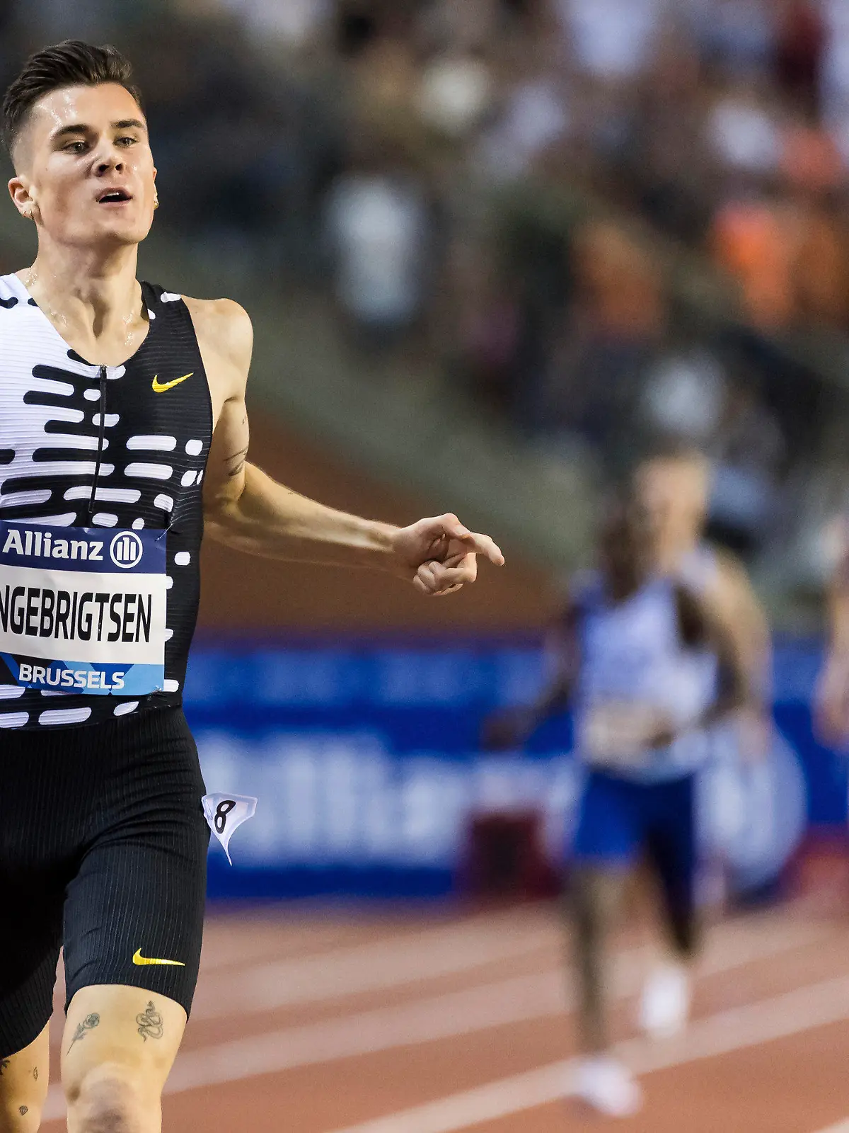 FILE - Jakob Ingebrigtsen from Norway crosses the finish line to win the 2000m men event and set a new world record time during the Diamond League Memorial Van Damme athletics event at the King Baudouin stadium, Brussels, on Sept. 8, 2023. Norwegian police launched an investigation Thursday, Oct. 26, 2023, into allegations by the three Ingebrigtsen brothers that their father, who had been their track coach at the Olympics and other events, was violent and abusive when they were growing up. (AP Photo/Geert Vanden Wijngaert)