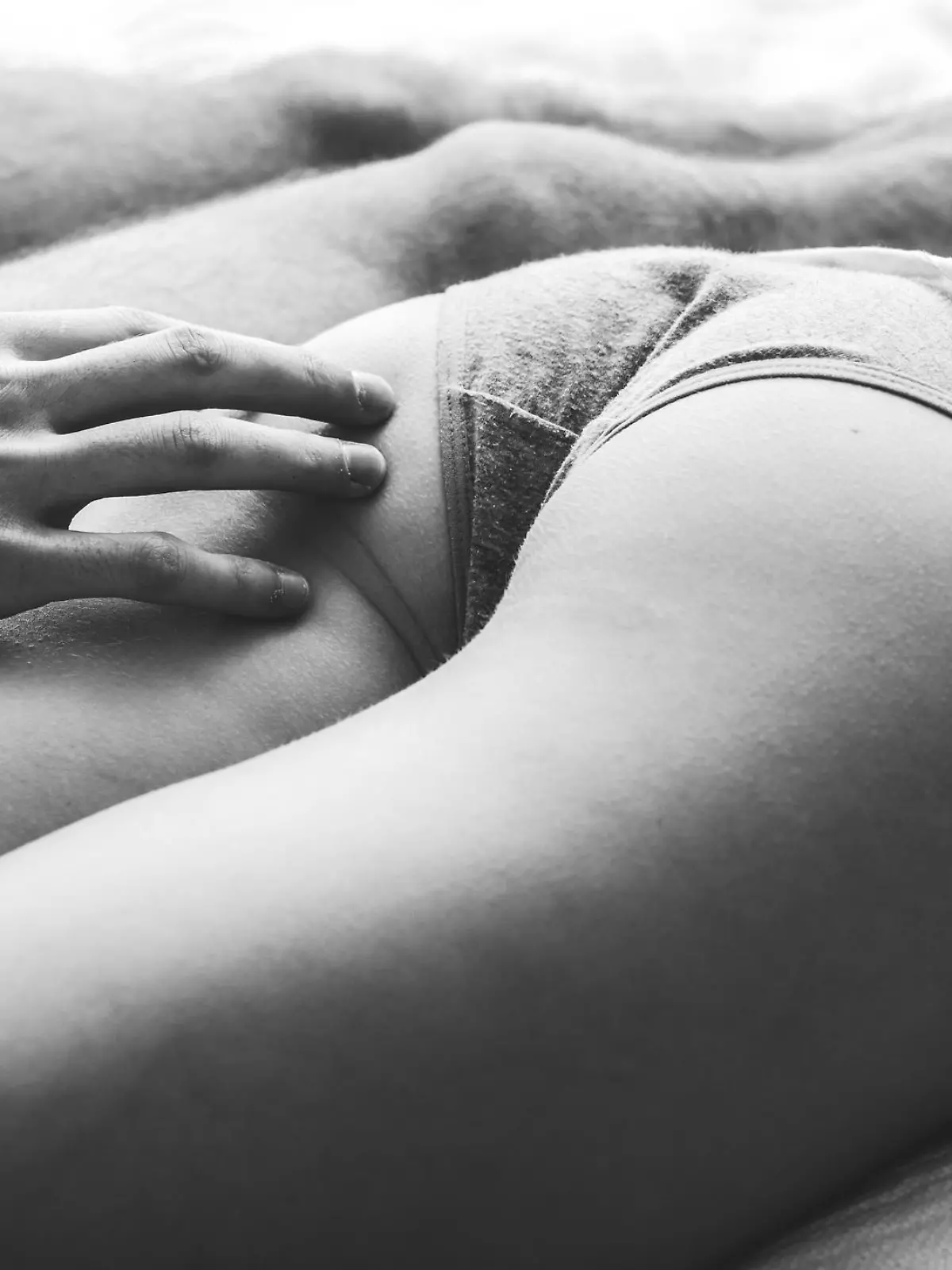 couple of young people having sex, they lie on the bed, hugging each other